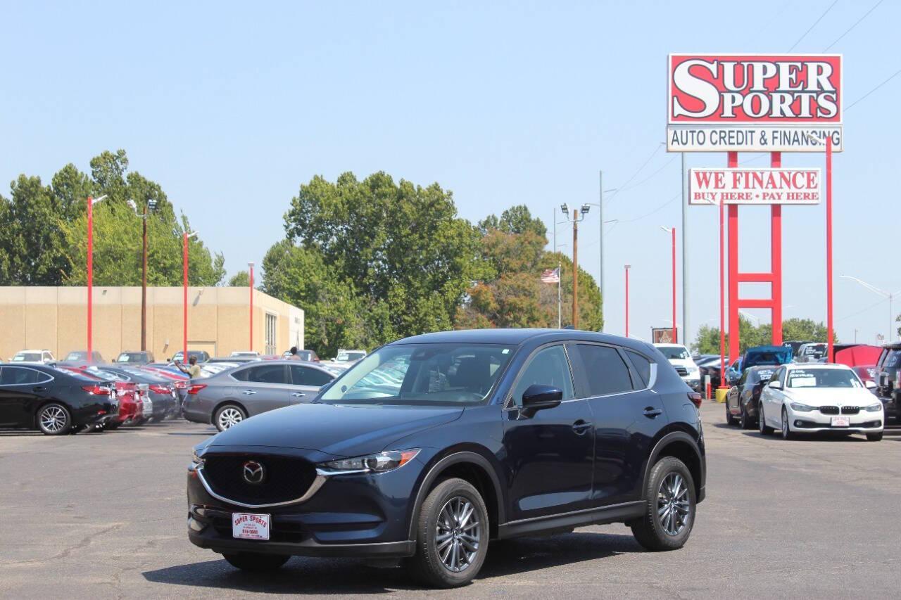 2019 Blue Mazda CX-5 Touring AWD (JM3KFBCMXK1) with an 2.5L I4 2.5L I4 engine, Automatic 6-Speed transmission, located at 4301 NW 39th , Oklahoma City, OK, 73112, (405) 949-5600, 35.512135, -97.598671 - NO DRIVERS LICENCE NO-FULL COVERAGE INSURANCE-NO CREDIT CHECK. COME ON OVER TO SUPERSPORTS AND TAKE A LOOK AND TEST DRIVE. PLEASE GIVE US A CALL AT (405) 949-5600. NO LICENSIA DE MANEJAR- NO SEGURO DE COBERTURA TOTAL- NO VERIFICACCION DE CREDITO. POR FAVOR VENGAN A SUPERSPORTS, ECHE UN - Photo#6