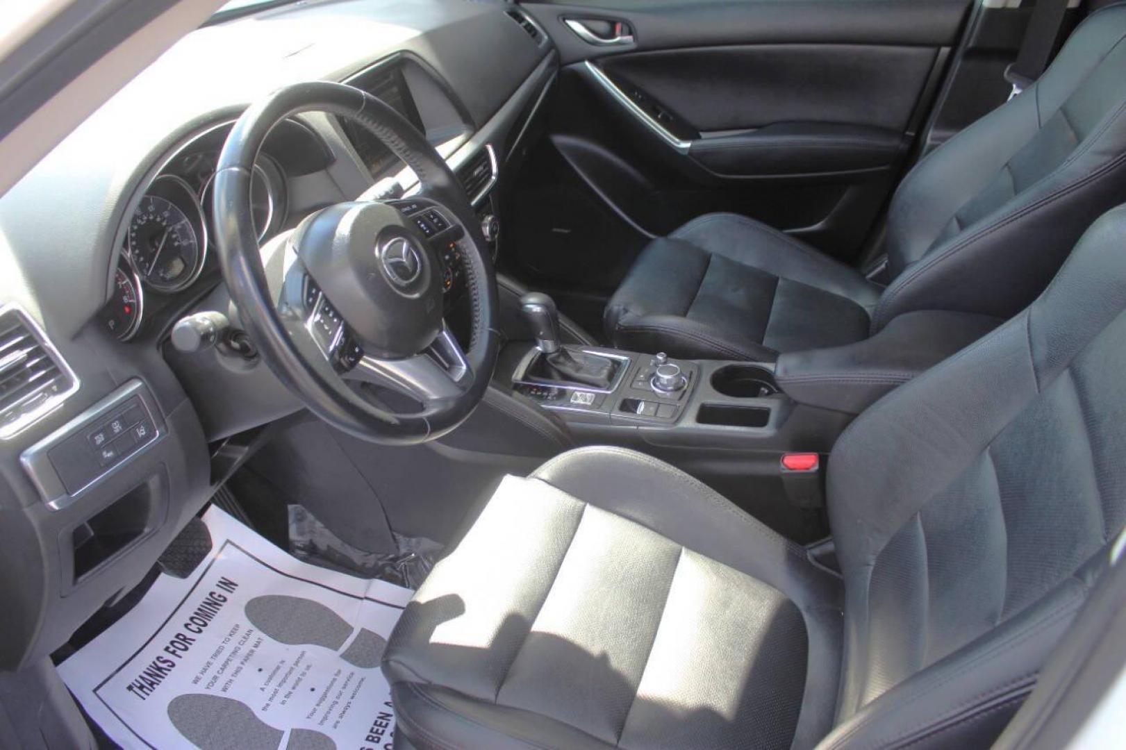 2016 White Mazda CX-5 Grand Touring (JM3KE2DY8G0) with an 2.5L L4 DOHC 16V engine, 6-Speed Automatic transmission, located at 4301 NW 39th , Oklahoma City, OK, 73112, (405) 949-5600, 35.512135, -97.598671 - NO DRIVERS LICENCE NO-FULL COVERAGE INSURANCE-NO CREDIT CHECK. COME ON OVER TO SUPERSPORTS AND TAKE A LOOK AND TEST DRIVE. PLEASE GIVE US A CALL AT (405) 949-5600. NO LICENSIA DE MANEJAR- NO SEGURO DE COBERTURA TOTAL- NO VERIFICACCION DE CREDITO. POR FAVOR VENGAN A SUPERSPORTS, ECHE UN - Photo#16