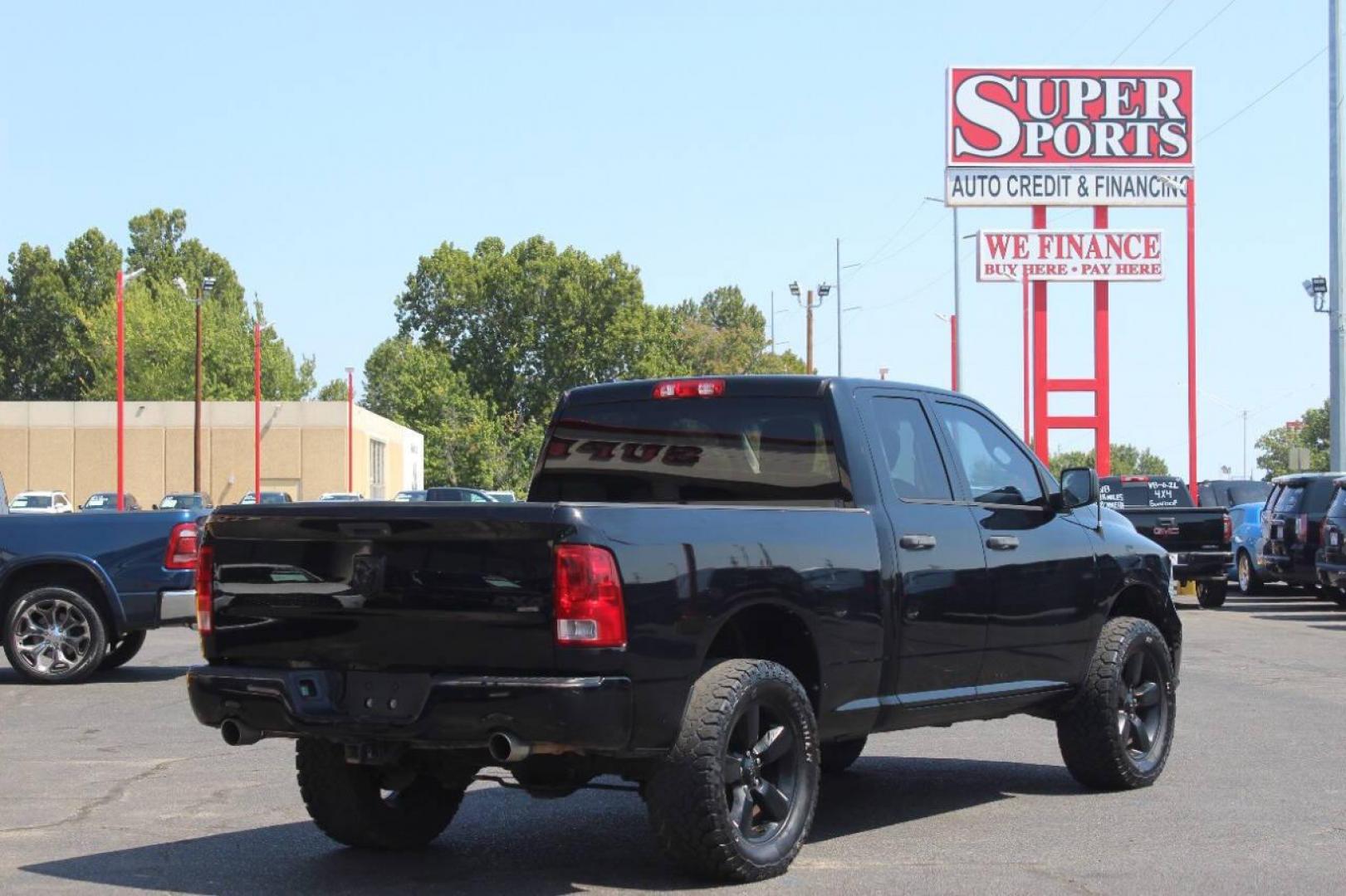 2014 Black RAM 1500 Tradesman Quad Cab 4WD (1C6RR7FT4ES) with an 5.7L V8 OHV 16V engine, 6-Speed Automatic transmission, located at 4301 NW 39th , Oklahoma City, OK, 73112, (405) 949-5600, 35.512135, -97.598671 - NO DRIVERS LICENCE NO-FULL COVERAGE INSURANCE-NO CREDIT CHECK. COME ON OVER TO SUPERSPORTS AND TAKE A LOOK AND TEST DRIVE. PLEASE GIVE US A CALL AT (405) 949-5600. NO LICENSIA DE MANEJAR- NO SEGURO DE COBERTURA TOTAL- NO VERIFICACCION DE CREDITO. POR FAVOR VENGAN A SUPERSPORTS, ECHE UN - Photo#3