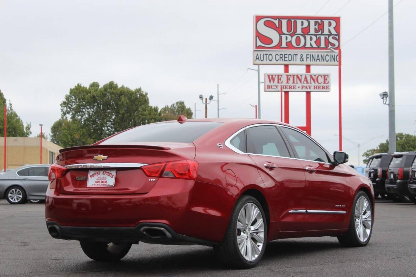 2014 Red Chevrolet Impala 2LZ (1G1155S36EU) with an 3.6L V6 DOHC 24VV FFV engine, 6-Speed Automatic transmission, located at 4301 NW 39th , Oklahoma City, OK, 73112, (405) 949-5600, 35.512135, -97.598671 - Photo#3