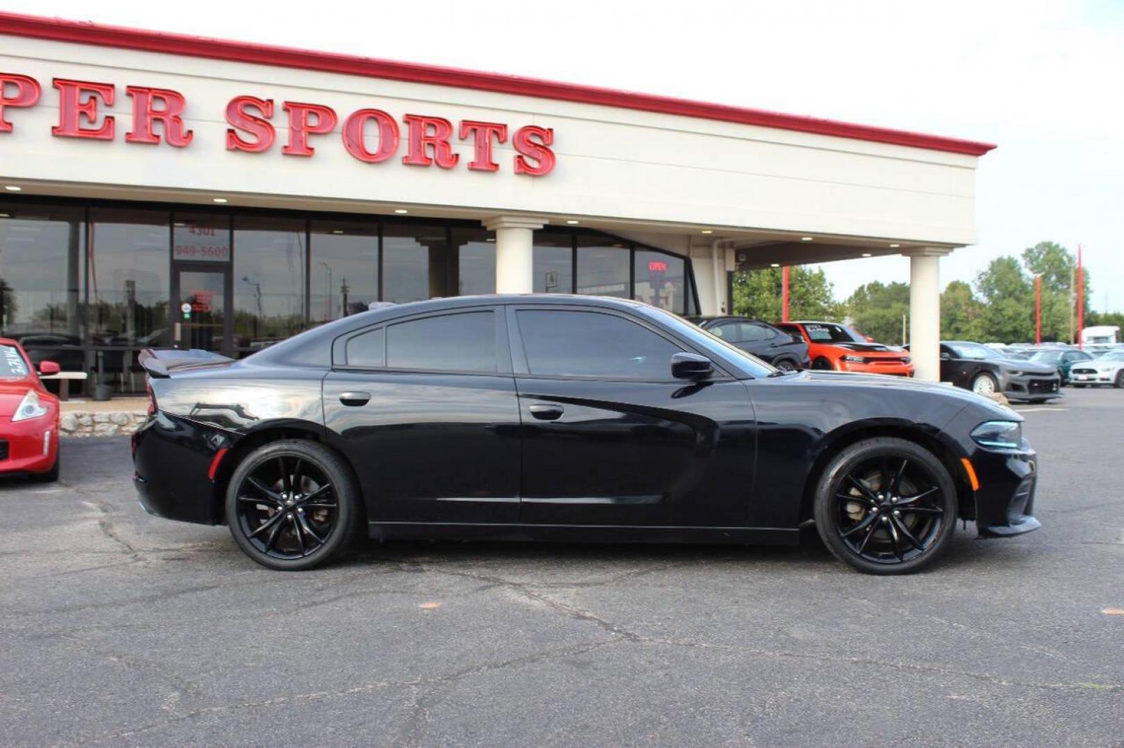 2016 Black Dodge Charger SE (2C3CDXBG0GH) with an 3.6L V6 DOHC 24V engine, 8A transmission, located at 4301 NW 39th , Oklahoma City, OK, 73112, (405) 949-5600, 35.512135, -97.598671 - NO DRIVERS LICENCE -NO FULL COVERAGE INSURANCE - NO CREDIT CHECK. COME ON OVER TO SUPERSPORTS, TAKE A LOOK AND TEST DRIVE. PLEASE GIVE US A CALL AT (405) 949-5600. NO LICENCIA DE CONDUCIR - NO SEGURO DE COBERTURA TOTAL - NO VERIFICACION DE CREDITO. VISITENOS EN SUPERSPORTS, MIRE NUESTRO - Photo#2