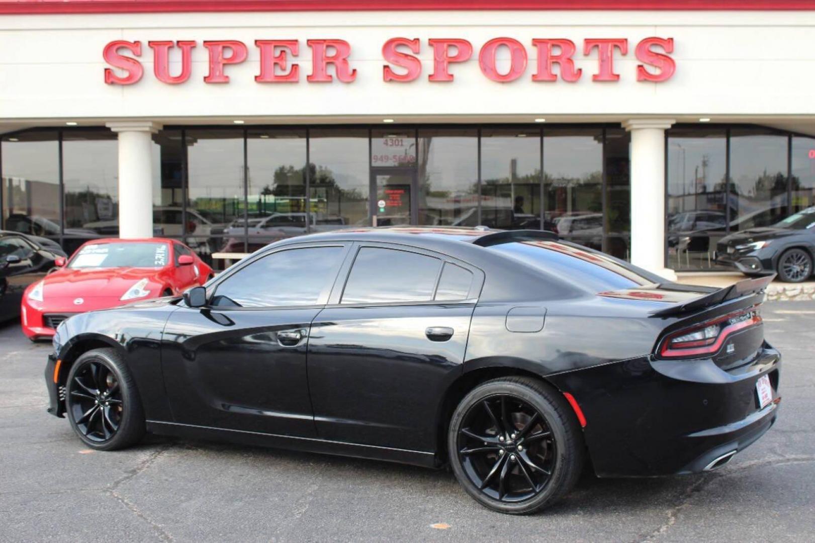 2016 Black Dodge Charger SE (2C3CDXBG0GH) with an 3.6L V6 DOHC 24V engine, 8A transmission, located at 4301 NW 39th , Oklahoma City, OK, 73112, (405) 949-5600, 35.512135, -97.598671 - NO DRIVERS LICENCE -NO FULL COVERAGE INSURANCE - NO CREDIT CHECK. COME ON OVER TO SUPERSPORTS, TAKE A LOOK AND TEST DRIVE. PLEASE GIVE US A CALL AT (405) 949-5600. NO LICENCIA DE CONDUCIR - NO SEGURO DE COBERTURA TOTAL - NO VERIFICACION DE CREDITO. VISITENOS EN SUPERSPORTS, MIRE NUESTRO - Photo#4