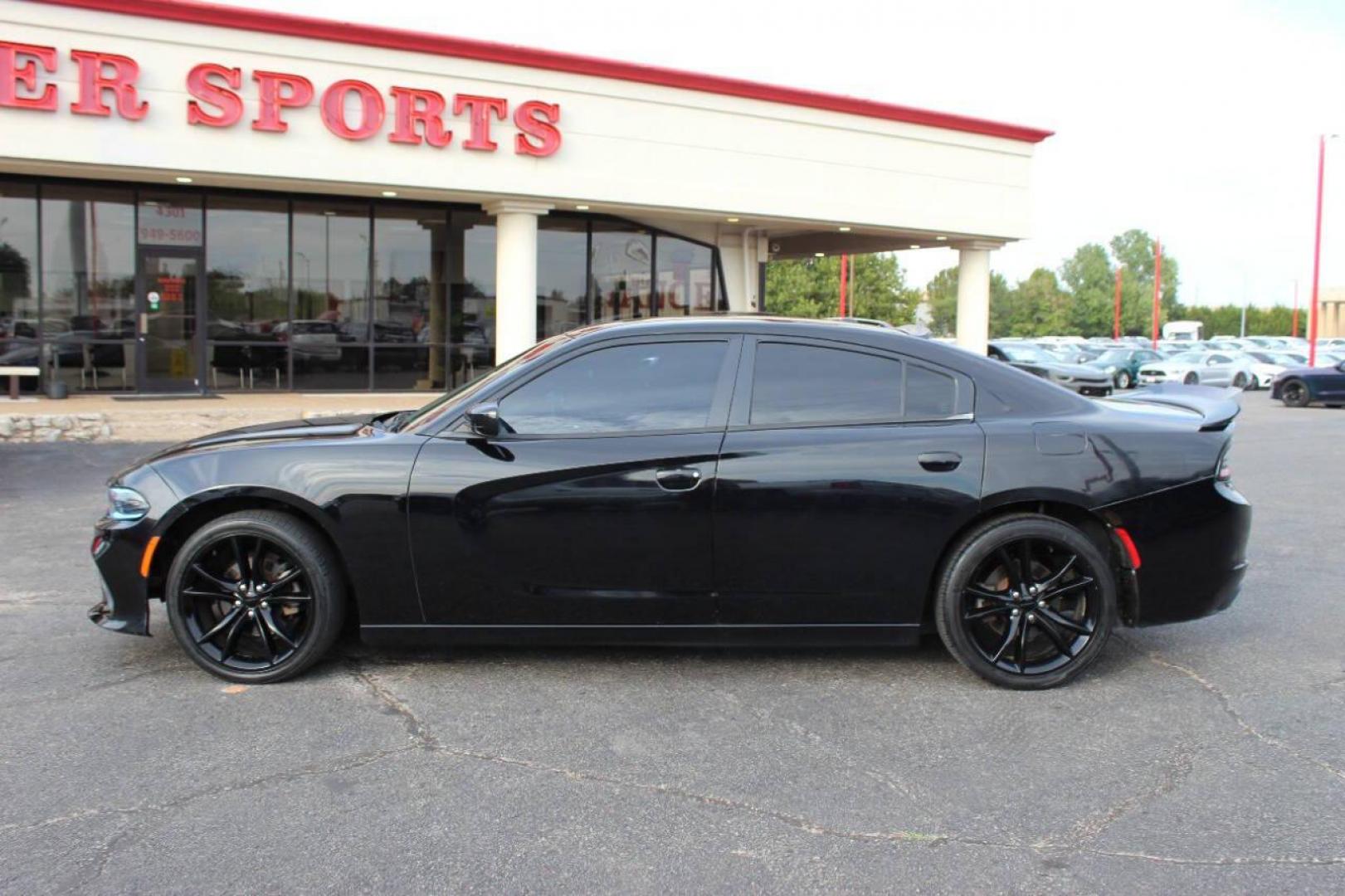 2016 Black Dodge Charger SE (2C3CDXBG0GH) with an 3.6L V6 DOHC 24V engine, 8A transmission, located at 4301 NW 39th , Oklahoma City, OK, 73112, (405) 949-5600, 35.512135, -97.598671 - NO DRIVERS LICENCE -NO FULL COVERAGE INSURANCE - NO CREDIT CHECK. COME ON OVER TO SUPERSPORTS, TAKE A LOOK AND TEST DRIVE. PLEASE GIVE US A CALL AT (405) 949-5600. NO LICENCIA DE CONDUCIR - NO SEGURO DE COBERTURA TOTAL - NO VERIFICACION DE CREDITO. VISITENOS EN SUPERSPORTS, MIRE NUESTRO - Photo#5