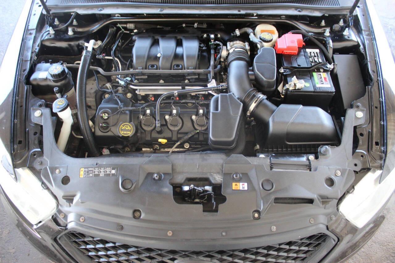 2017 Black Ford Taurus SEL FWD (1FAHP2E8XHG) with an 3.5L V6 DOHC 24V engine, 6A transmission, located at 4301 NW 39th , Oklahoma City, OK, 73112, (405) 949-5600, 35.512135, -97.598671 - NO DRIVERS LICENCE -NO FULL COVERAGE INSURANCE - NO CREDIT CHECK. COME ON OVER TO SUPERSPORTS, TAKE A LOOK AND TEST DRIVE. PLEASE GIVE US A CALL AT (405) 949-5600. NO LICENCIA DE CONDUCIR - NO SEGURO DE COBERTURA TOTAL - NO VERIFICACION DE CREDITO. VISITENOS EN SUPERSPORTS, MIRE NUESTRO - Photo#7