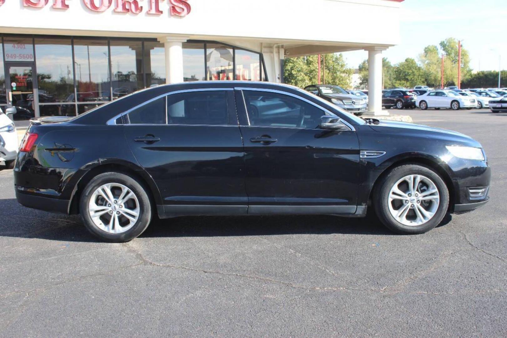 2017 Black Ford Taurus SEL FWD (1FAHP2E8XHG) with an 3.5L V6 DOHC 24V engine, 6A transmission, located at 4301 NW 39th , Oklahoma City, OK, 73112, (405) 949-5600, 35.512135, -97.598671 - NO DRIVERS LICENCE NO-FULL COVERAGE INSURANCE-NO CREDIT CHECK. COME ON OVER TO SUPERSPORTS AND TAKE A LOOK AND TEST DRIVE. PLEASE GIVE US A CALL AT (405) 949-5600. NO LICENSIA DE MANEJAR- NO SEGURO DE COBERTURA TOTAL- NO VERIFICACCION DE CREDITO. POR FAVOR VENGAN A SUPERSPORTS, ECHE UN - Photo#4
