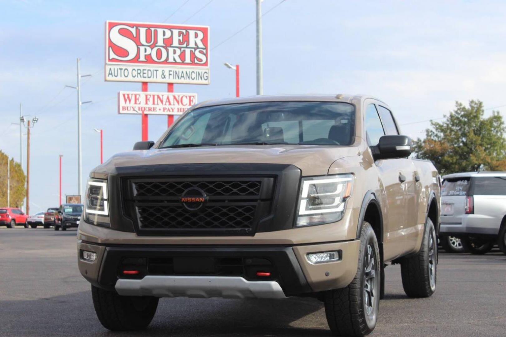 2020 Tan Nissan Titan Platinum Reserve Crew Cab 4WD (1N6AA1ED5LN) with an 5.6L V8 DOHC 32V engine, 6A transmission, located at 4301 NW 39th , Oklahoma City, OK, 73112, (405) 949-5600, 35.512135, -97.598671 - NO DRIVERS LICENCE NO-FULL COVERAGE INSURANCE-NO CREDIT CHECK. COME ON OVER TO SUPERSPORTS AND TAKE A LOOK AND TEST DRIVE. PLEASE GIVE US A CALL AT (405) 949-5600. NO LICENSIA DE MANEJAR- NO SEGURO DE COBERTURA TOTAL- NO VERIFICACCION DE CREDITO. POR FAVOR VENGAN A SUPERSPORTS, ECHE UN - Photo#8