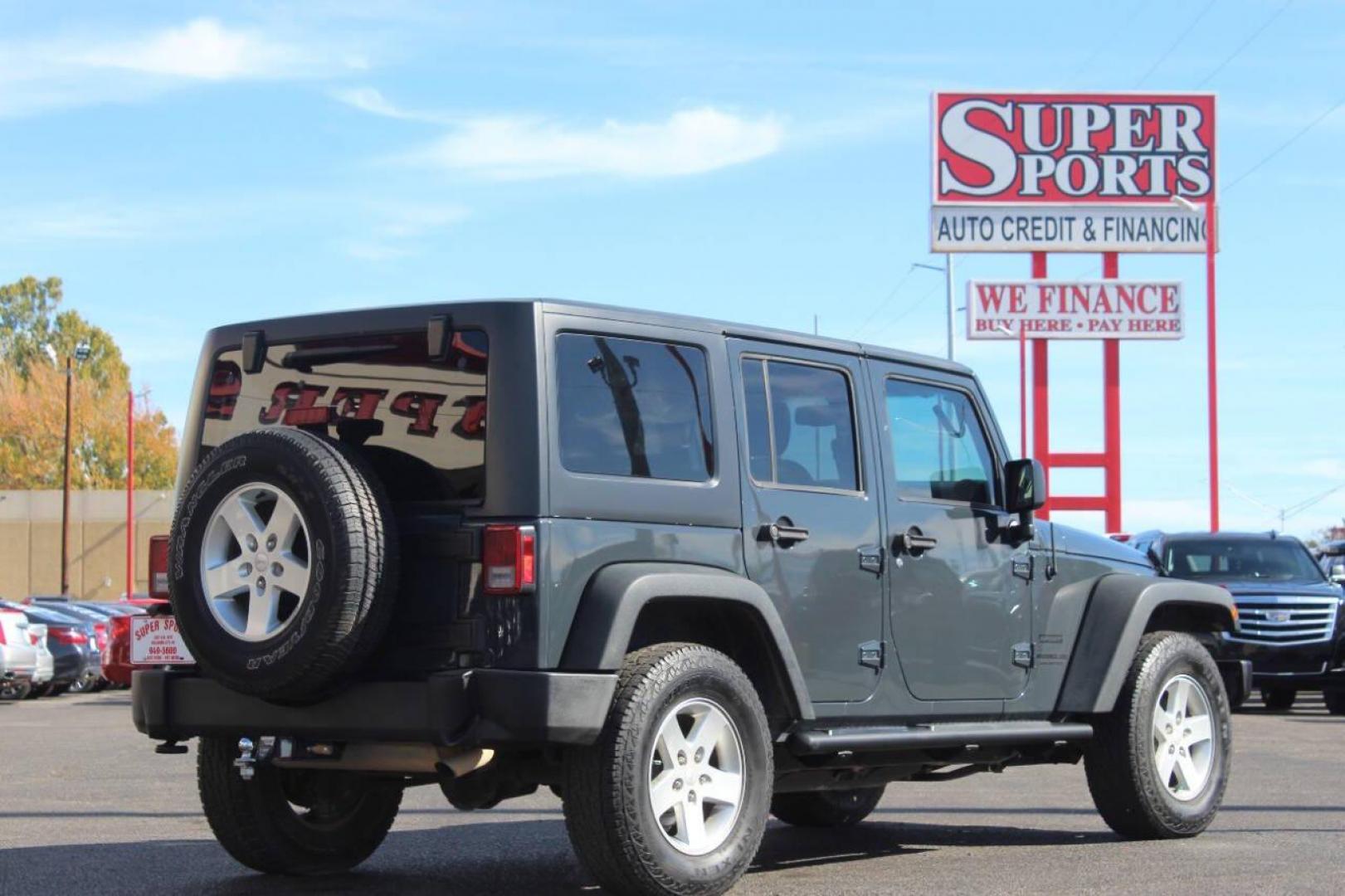 2016 Gray Jeep Wrangler Unlimited Sport 4WD (1C4BJWDG0GL) with an 3.6L V6 DOHC 24V FFV engine, Automatic 5-Speed transmission, located at 4301 NW 39th , Oklahoma City, OK, 73112, (405) 949-5600, 35.512135, -97.598671 - NO DRIVERS LICENCE NO-FULL COVERAGE INSURANCE-NO CREDIT CHECK. COME ON OVER TO SUPERSPORTS AND TAKE A LOOK AND TEST DRIVE. PLEASE GIVE US A CALL AT (405) 949-5600. NO LICENSIA DE MANEJAR- NO SEGURO DE COBERTURA TOTAL- NO VERIFICACCION DE CREDITO. POR FAVOR VENGAN A SUPERSPORTS, ECHE UN - Photo#4