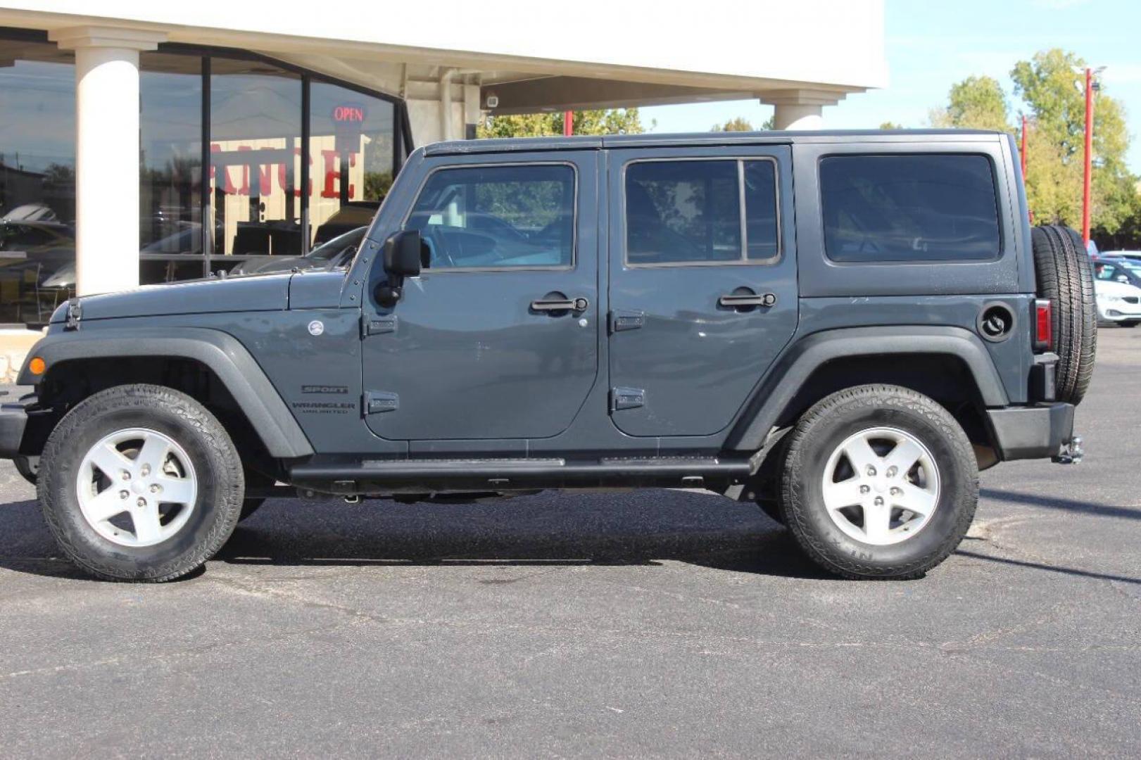 2016 Gray Jeep Wrangler Unlimited Sport 4WD (1C4BJWDG0GL) with an 3.6L V6 DOHC 24V FFV engine, Automatic 5-Speed transmission, located at 4301 NW 39th , Oklahoma City, OK, 73112, (405) 949-5600, 35.512135, -97.598671 - NO DRIVERS LICENCE NO-FULL COVERAGE INSURANCE-NO CREDIT CHECK. COME ON OVER TO SUPERSPORTS AND TAKE A LOOK AND TEST DRIVE. PLEASE GIVE US A CALL AT (405) 949-5600. NO LICENSIA DE MANEJAR- NO SEGURO DE COBERTURA TOTAL- NO VERIFICACCION DE CREDITO. POR FAVOR VENGAN A SUPERSPORTS, ECHE UN - Photo#6