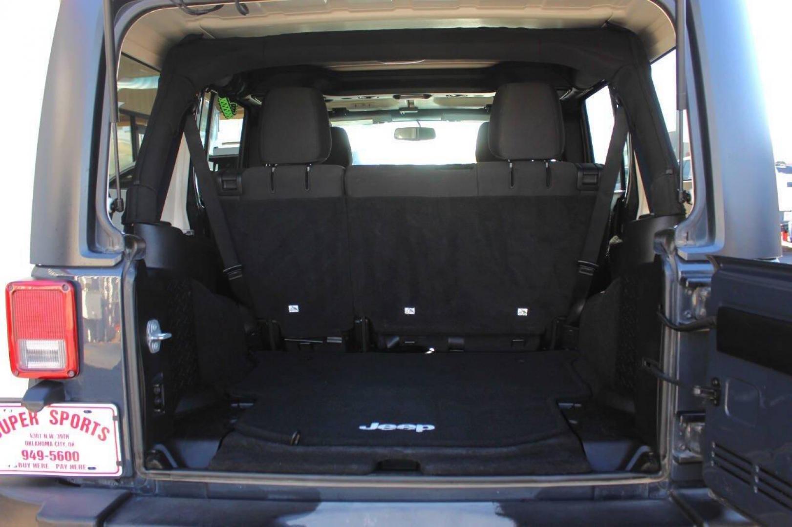 2016 Gray Jeep Wrangler Unlimited Sport 4WD (1C4BJWDG0GL) with an 3.6L V6 DOHC 24V FFV engine, Automatic 5-Speed transmission, located at 4301 NW 39th , Oklahoma City, OK, 73112, (405) 949-5600, 35.512135, -97.598671 - NO DRIVERS LICENCE NO-FULL COVERAGE INSURANCE-NO CREDIT CHECK. COME ON OVER TO SUPERSPORTS AND TAKE A LOOK AND TEST DRIVE. PLEASE GIVE US A CALL AT (405) 949-5600. NO LICENSIA DE MANEJAR- NO SEGURO DE COBERTURA TOTAL- NO VERIFICACCION DE CREDITO. POR FAVOR VENGAN A SUPERSPORTS, ECHE UN - Photo#12