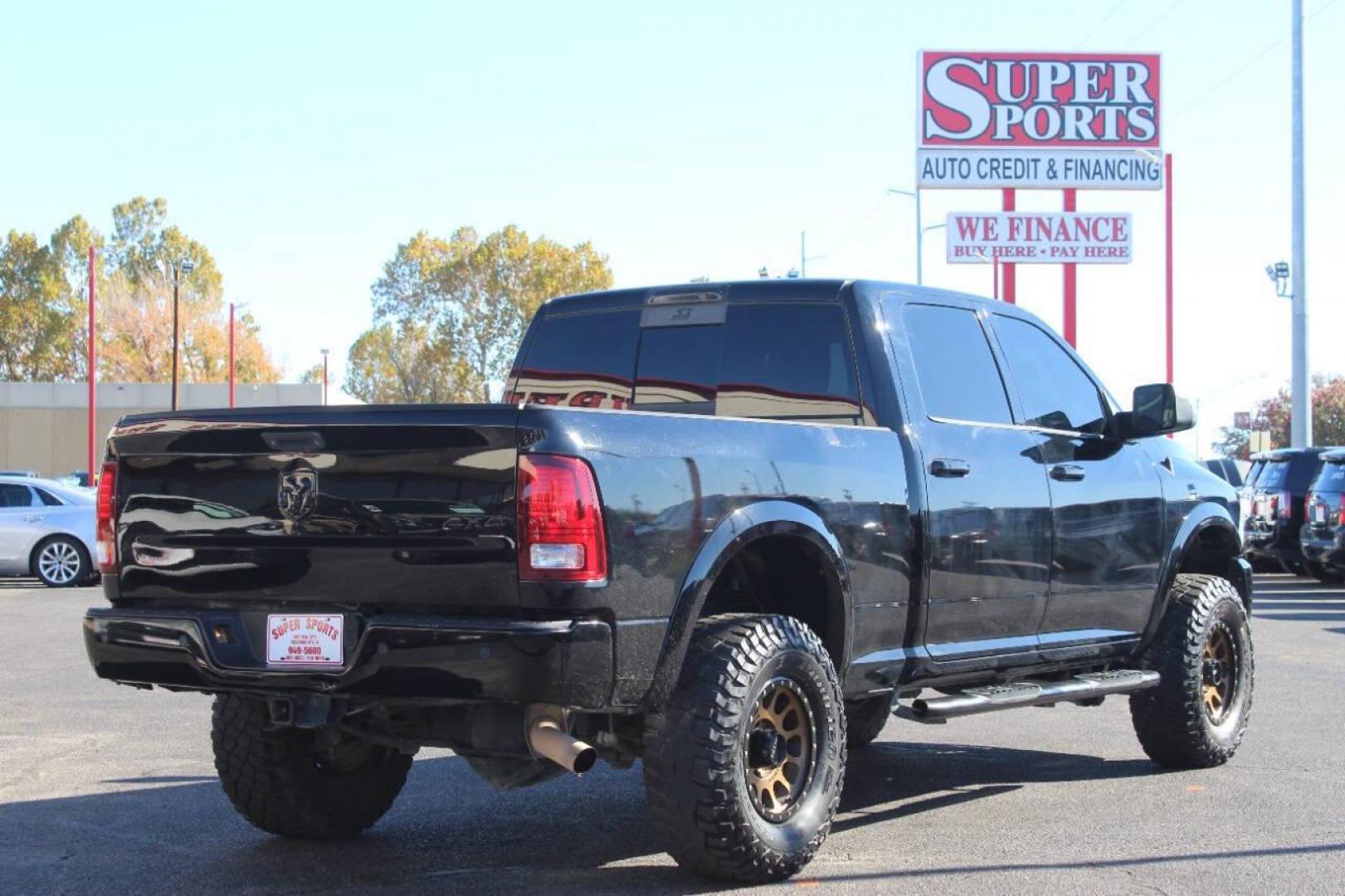 2014 Black RAM 2500 Laramie Crew Cab SWB 4WD (3C6UR5FJ2EG) with an 6.7L L6 engine, 6-Speed Automatic transmission, located at 4301 NW 39th , Oklahoma City, OK, 73112, (405) 949-5600, 35.512135, -97.598671 - NO DRIVERS LICENCE NO-FULL COVERAGE INSURANCE-NO CREDIT CHECK. COME ON OVER TO SUPERSPORTS AND TAKE A LOOK AND TEST DRIVE. PLEASE GIVE US A CALL AT (405) 949-5600. NO LICENSIA DE MANEJAR- NO SEGURO DE COBERTURA TOTAL- NO VERIFICACCION DE CREDITO. POR FAVOR VENGAN A SUPERSPORTS, ECHE UN - Photo#2
