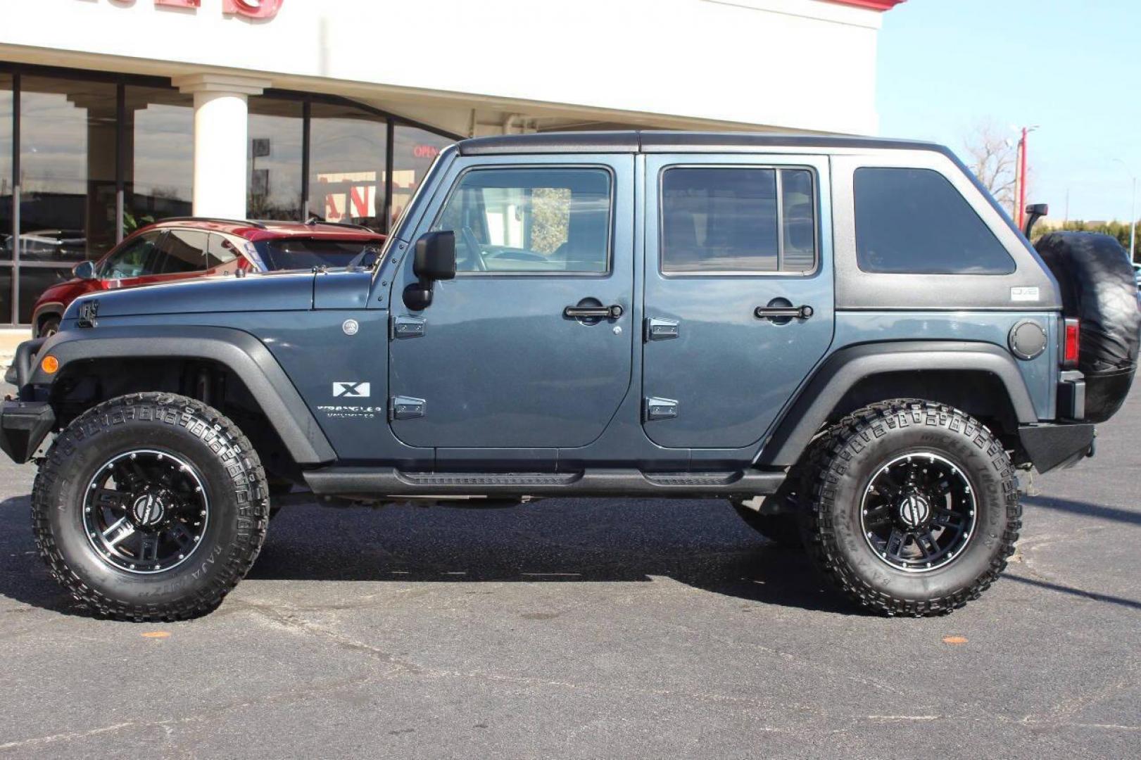 2008 Blue Jeep Wrangler Unlimited X 4WD (1J4GA39138L) with an 3.8L V6 OHV 12V engine, Automatic 4-Speed transmission, located at 4301 NW 39th , Oklahoma City, OK, 73112, (405) 949-5600, 35.512135, -97.598671 - NO DRIVERS LICENCE NO-FULL COVERAGE INSURANCE-NO CREDIT CHECK. COME ON OVER TO SUPERSPORTS AND TAKE A LOOK AND TEST DRIVE. PLEASE GIVE US A CALL AT (405) 949-5600. NO LICENSIA DE MANEJAR- NO SEGURO DE COBERTURA TOTAL- NO VERIFICACCION DE CREDITO. POR FAVOR VENGAN A SUPERSPORTS, ECHE UN - Photo#7