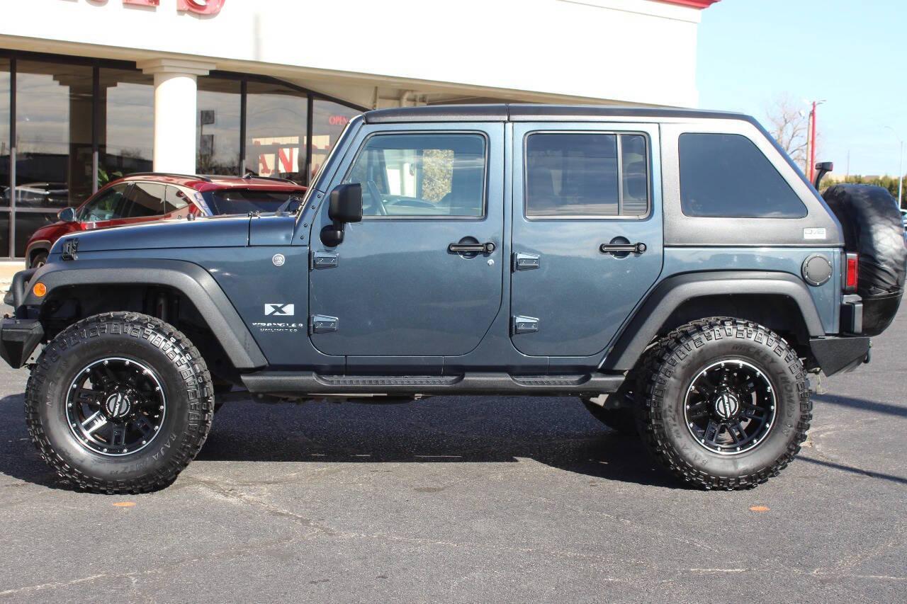 2008 Gray Jeep Wrangler Unlimited X 4WD (1J4GA39138L) with an 3.8L V6 OHV 12V engine, Automatic 4-Speed transmission, located at 4301 NW 39th , Oklahoma City, OK, 73112, (405) 949-5600, 35.512135, -97.598671 - NO DRIVERS LICENCE -NO FULL COVERAGE INSURANCE - NO CREDIT CHECK. COME ON OVER TO SUPERSPORTS, TAKE A LOOK AND TEST DRIVE. PLEASE GIVE US A CALL AT (405) 949-5600. NO LICENCIA DE CONDUCIR - NO SEGURO DE COBERTURA TOTAL - NO VERIFICACION DE CREDITO. VISITENOS EN SUPERSPORTS, MIRE NUESTRO - Photo#6