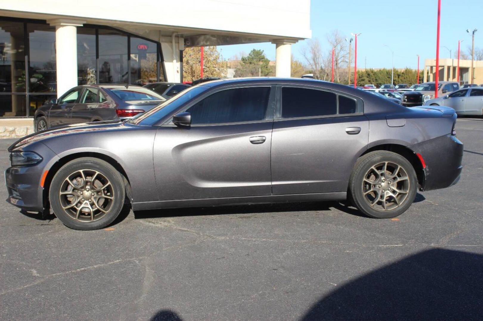 2015 Gray Dodge Charger SXT AWD (2C3CDXJG2FH) with an 3.6L V6 DOHC 24V engine, 8-Speed Automatic transmission, located at 4301 NW 39th , Oklahoma City, OK, 73112, (405) 949-5600, 35.512135, -97.598671 - NO DRIVERS LICENCE NO-FULL COVERAGE INSURANCE-NO CREDIT CHECK. COME ON OVER TO SUPERSPORTS AND TAKE A LOOK AND TEST DRIVE. PLEASE GIVE US A CALL AT (405) 949-5600. NO LICENSIA DE MANEJAR- NO SEGURO DE COBERTURA TOTAL- NO VERIFICACCION DE CREDITO. POR FAVOR VENGAN A SUPERSPORTS, ECHE U - Photo#5