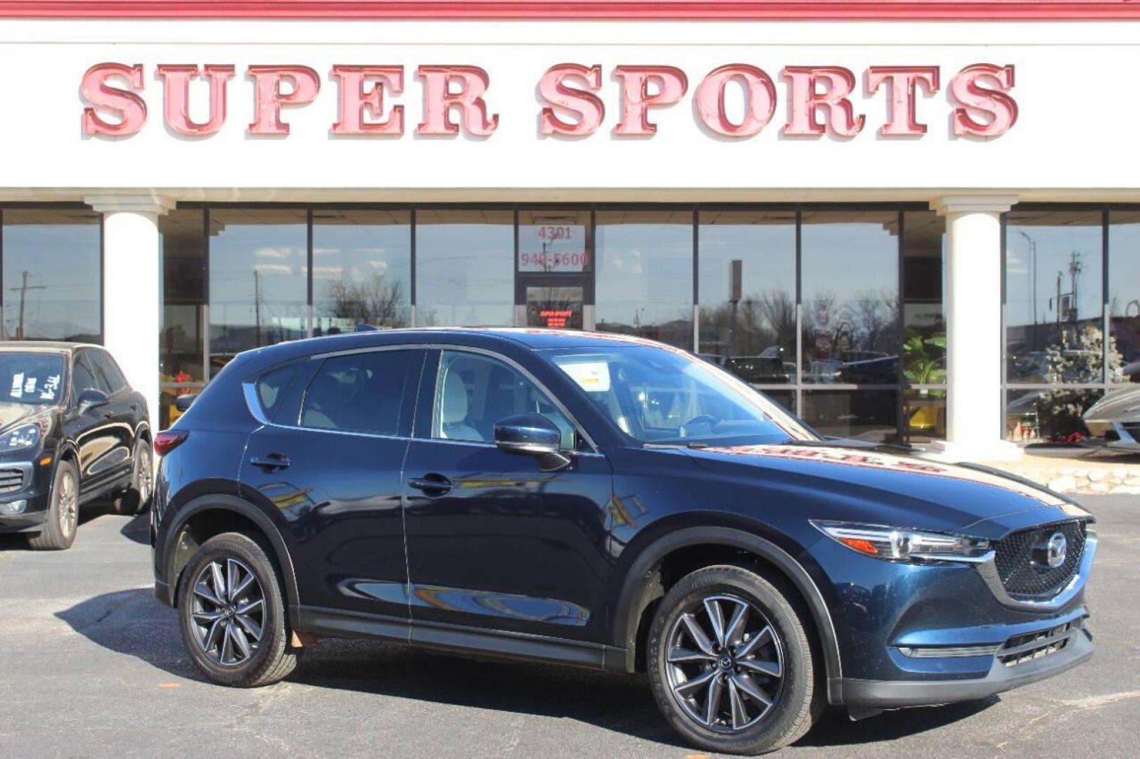 2017 Blue Mazda CX-5 Grand Touring (JM3KFADLXH0) with an 2.5L L4 DOHC 16V engine, 6A transmission, located at 4301 NW 39th , Oklahoma City, OK, 73112, (405) 949-5600, 35.512135, -97.598671 - NO DRIVERS LICENCE NO-FULL COVERAGE INSURANCE-NO CREDIT CHECK. COME ON OVER TO SUPERSPORTS AND TAKE A LOOK AND TEST DRIVE. PLEASE GIVE US A CALL AT (405) 949-5600. NO LICENSIA DE MANEJAR- NO SEGURO DE COBERTURA TOTAL- NO VERIFICACCION DE CREDITO. POR FAVOR VENGAN A SUPERSPORTS, ECHE U - Photo#0