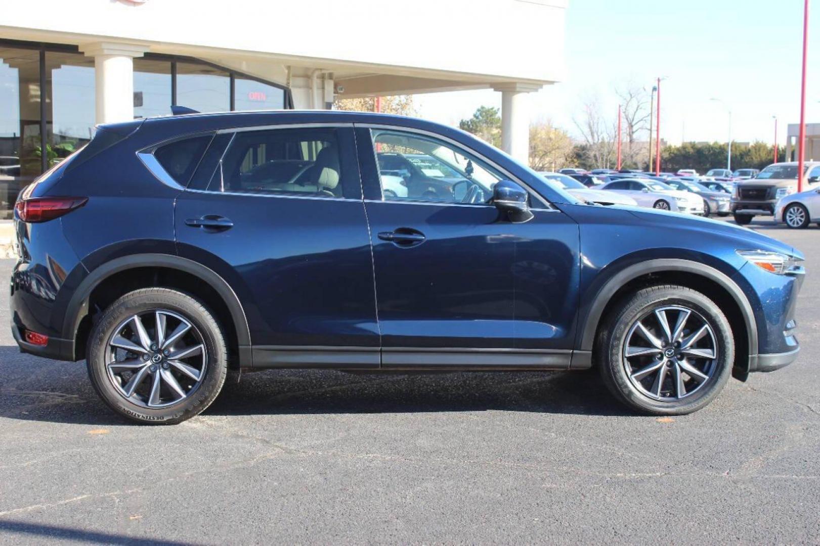 2017 Blue Mazda CX-5 Grand Touring (JM3KFADLXH0) with an 2.5L L4 DOHC 16V engine, 6A transmission, located at 4301 NW 39th , Oklahoma City, OK, 73112, (405) 949-5600, 35.512135, -97.598671 - NO DRIVERS LICENCE NO-FULL COVERAGE INSURANCE-NO CREDIT CHECK. COME ON OVER TO SUPERSPORTS AND TAKE A LOOK AND TEST DRIVE. PLEASE GIVE US A CALL AT (405) 949-5600. NO LICENSIA DE MANEJAR- NO SEGURO DE COBERTURA TOTAL- NO VERIFICACCION DE CREDITO. POR FAVOR VENGAN A SUPERSPORTS, ECHE U - Photo#2