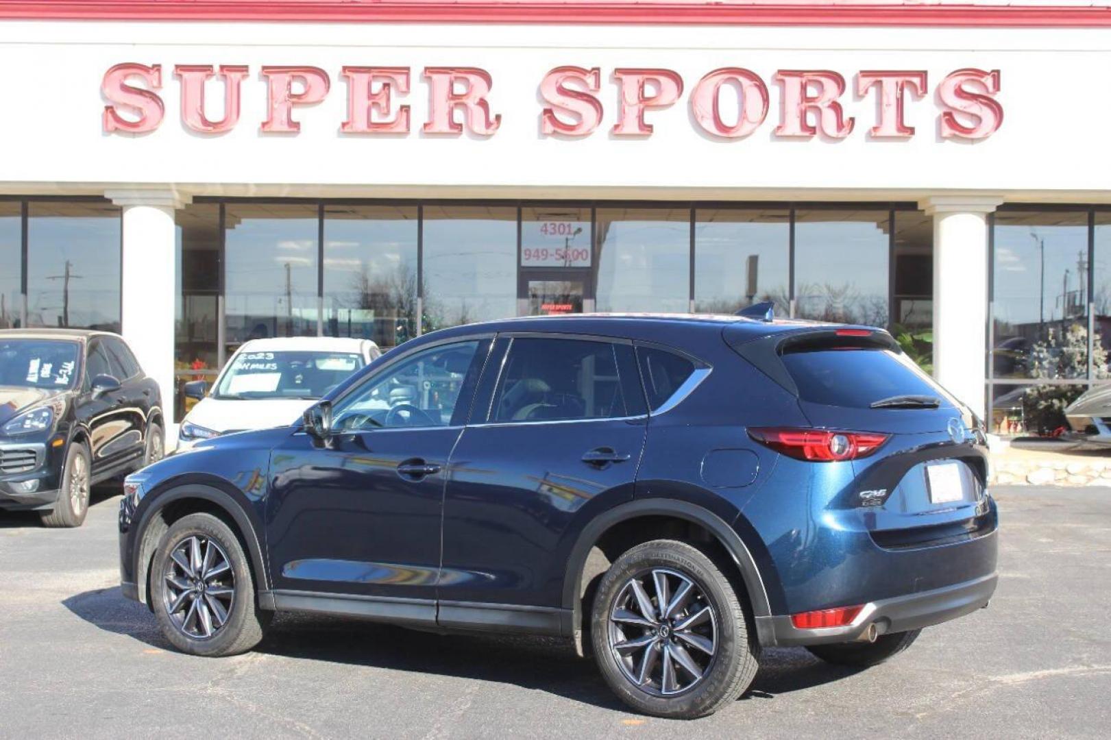2017 Blue Mazda CX-5 Grand Touring (JM3KFADLXH0) with an 2.5L L4 DOHC 16V engine, 6A transmission, located at 4301 NW 39th , Oklahoma City, OK, 73112, (405) 949-5600, 35.512135, -97.598671 - NO DRIVERS LICENCE NO-FULL COVERAGE INSURANCE-NO CREDIT CHECK. COME ON OVER TO SUPERSPORTS AND TAKE A LOOK AND TEST DRIVE. PLEASE GIVE US A CALL AT (405) 949-5600. NO LICENSIA DE MANEJAR- NO SEGURO DE COBERTURA TOTAL- NO VERIFICACCION DE CREDITO. POR FAVOR VENGAN A SUPERSPORTS, ECHE U - Photo#4