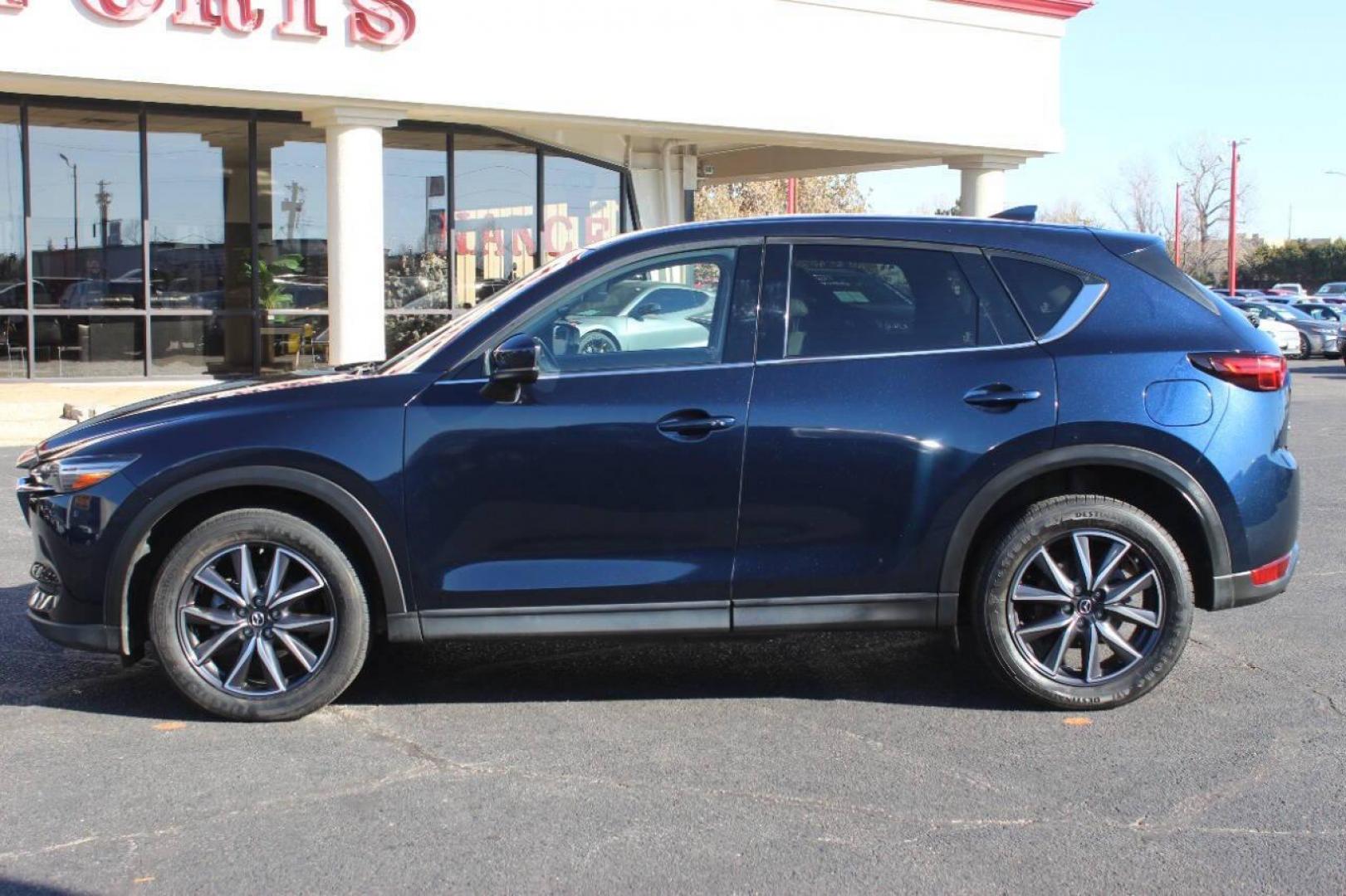 2017 Blue Mazda CX-5 Grand Touring (JM3KFADLXH0) with an 2.5L L4 DOHC 16V engine, 6A transmission, located at 4301 NW 39th , Oklahoma City, OK, 73112, (405) 949-5600, 35.512135, -97.598671 - NO DRIVERS LICENCE NO-FULL COVERAGE INSURANCE-NO CREDIT CHECK. COME ON OVER TO SUPERSPORTS AND TAKE A LOOK AND TEST DRIVE. PLEASE GIVE US A CALL AT (405) 949-5600. NO LICENSIA DE MANEJAR- NO SEGURO DE COBERTURA TOTAL- NO VERIFICACCION DE CREDITO. POR FAVOR VENGAN A SUPERSPORTS, ECHE U - Photo#5