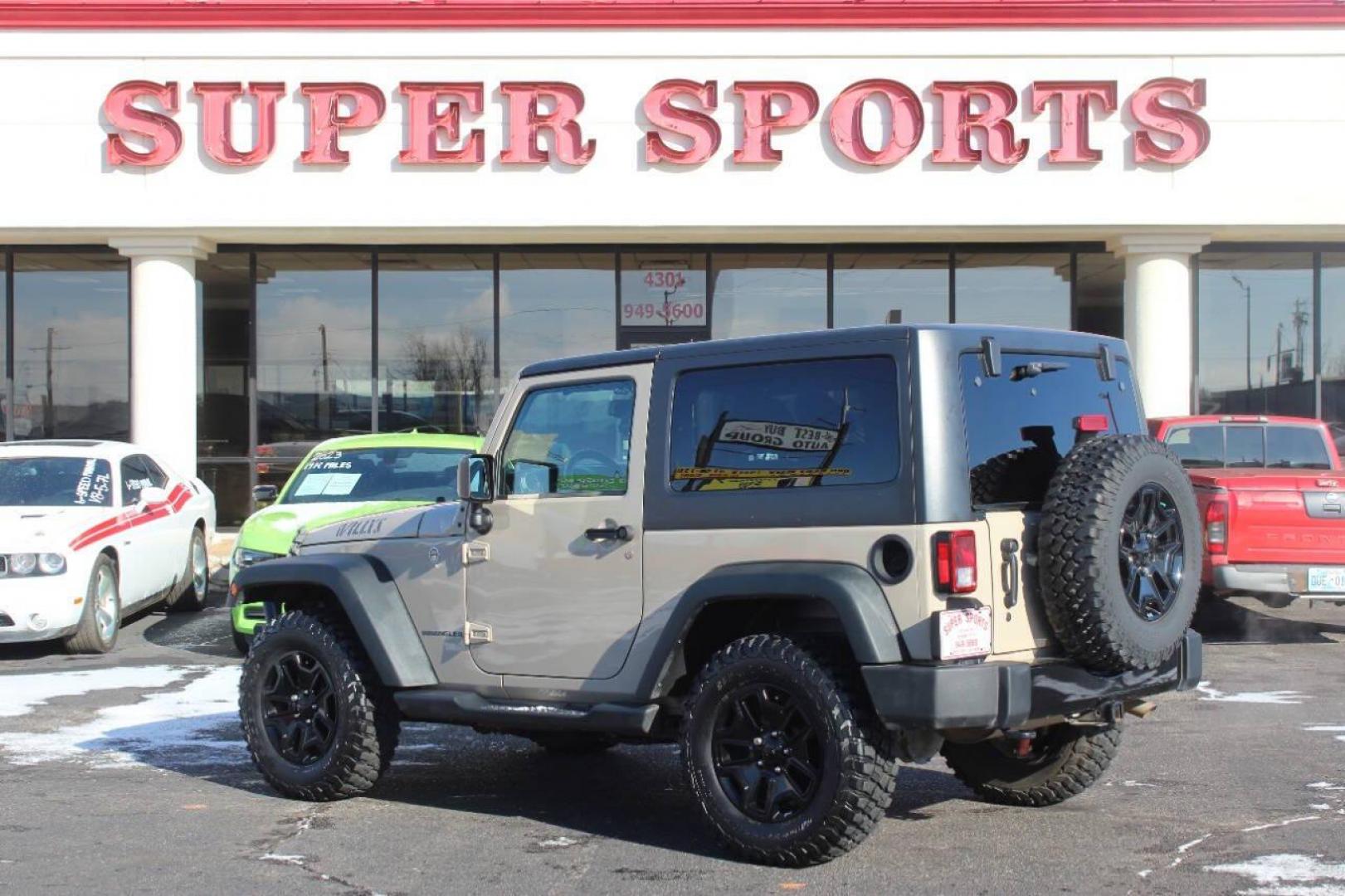 2016 Tan Jeep Wrangler Sport 4WD (1C4AJWAG7GL) with an 3.6L V6 DOHC 24V FFV engine, Automatic 5-Speed transmission, located at 4301 NW 39th , Oklahoma City, OK, 73112, (405) 949-5600, 35.512135, -97.598671 - NO DRIVERS LICENCE NO-FULL COVERAGE INSURANCE-NO CREDIT CHECK. COME ON OVER TO SUPERSPORTS AND TAKE A LOOK AND TEST DRIVE. PLEASE GIVE US A CALL AT (405) 949-5600. NO LICENSIA DE MANEJAR- NO SEGURO DE COBERTURA TOTAL- NO VERIFICACCION DE CREDITO. POR FAVOR VENGAN A SUPERSPORTS, ECHE U - Photo#5