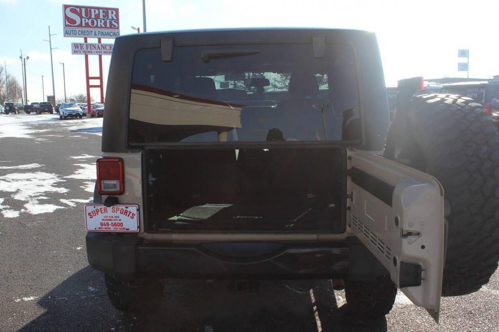 2016 Tan Jeep Wrangler Sport 4WD (1C4AJWAG7GL) with an 3.6L V6 DOHC 24V FFV engine, Automatic 5-Speed transmission, located at 4301 NW 39th , Oklahoma City, OK, 73112, (405) 949-5600, 35.512135, -97.598671 - NO DRIVERS LICENCE -NO FULL COVERAGE INSURANCE - NO CREDIT CHECK. COME ON OVER TO SUPERSPORTS, TAKE A LOOK AND TEST DRIVE. PLEASE GIVE US A CALL AT (405) 949-5600. NO LICENCIA DE CONDUCIR - NO SEGURO DE COBERTURA TOTAL - NO VERIFICACION DE CREDITO. VISITENOS EN SUPERSPORTS, MIRE NUESTRO - Photo#11