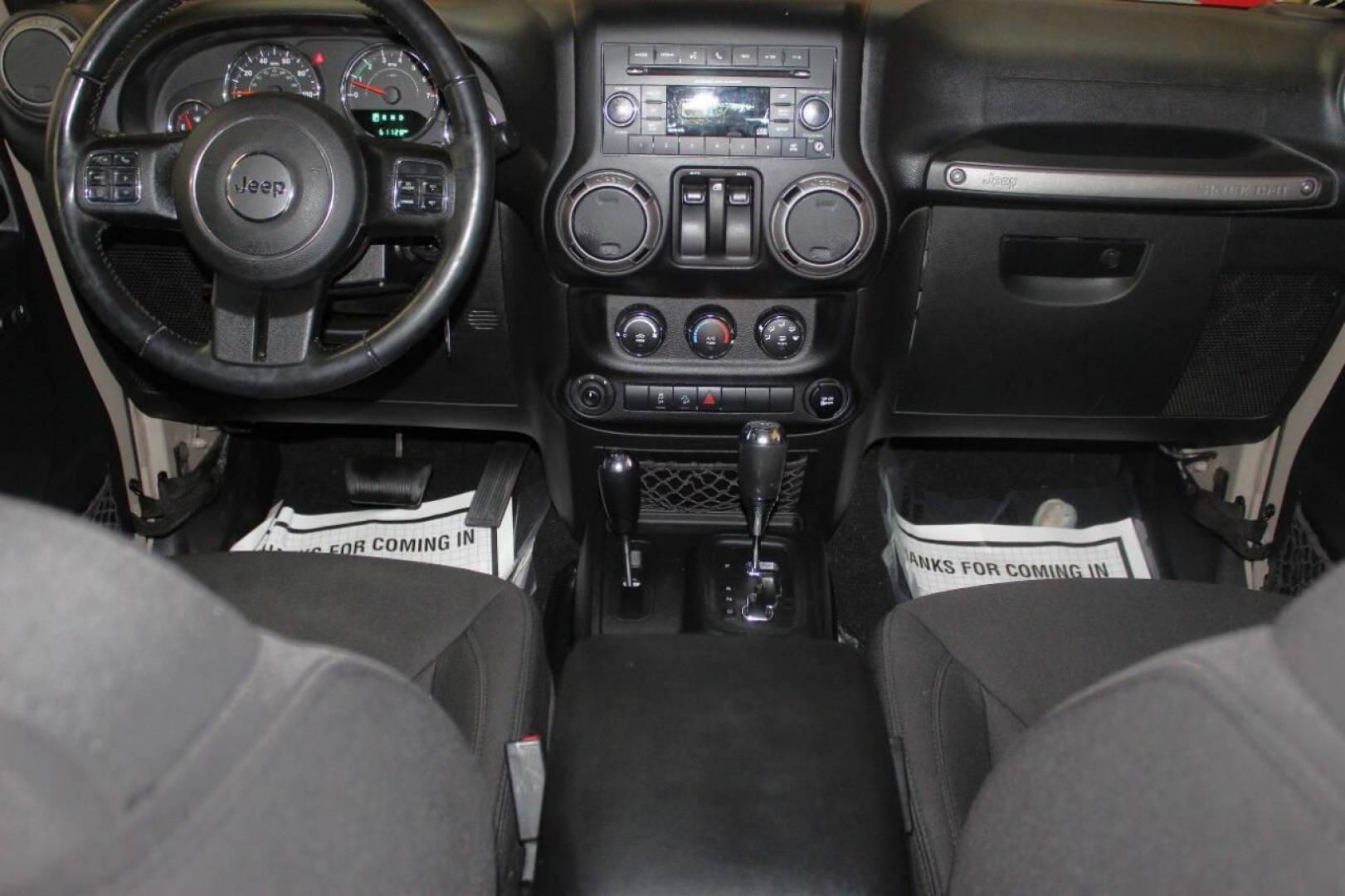 2016 Tan Jeep Wrangler Sport 4WD (1C4AJWAG7GL) with an 3.6L V6 DOHC 24V FFV engine, Automatic 5-Speed transmission, located at 4301 NW 39th , Oklahoma City, OK, 73112, (405) 949-5600, 35.512135, -97.598671 - NO DRIVERS LICENCE -NO FULL COVERAGE INSURANCE - NO CREDIT CHECK. COME ON OVER TO SUPERSPORTS, TAKE A LOOK AND TEST DRIVE. PLEASE GIVE US A CALL AT (405) 949-5600. NO LICENCIA DE CONDUCIR - NO SEGURO DE COBERTURA TOTAL - NO VERIFICACION DE CREDITO. VISITENOS EN SUPERSPORTS, MIRE NUESTRO - Photo#15