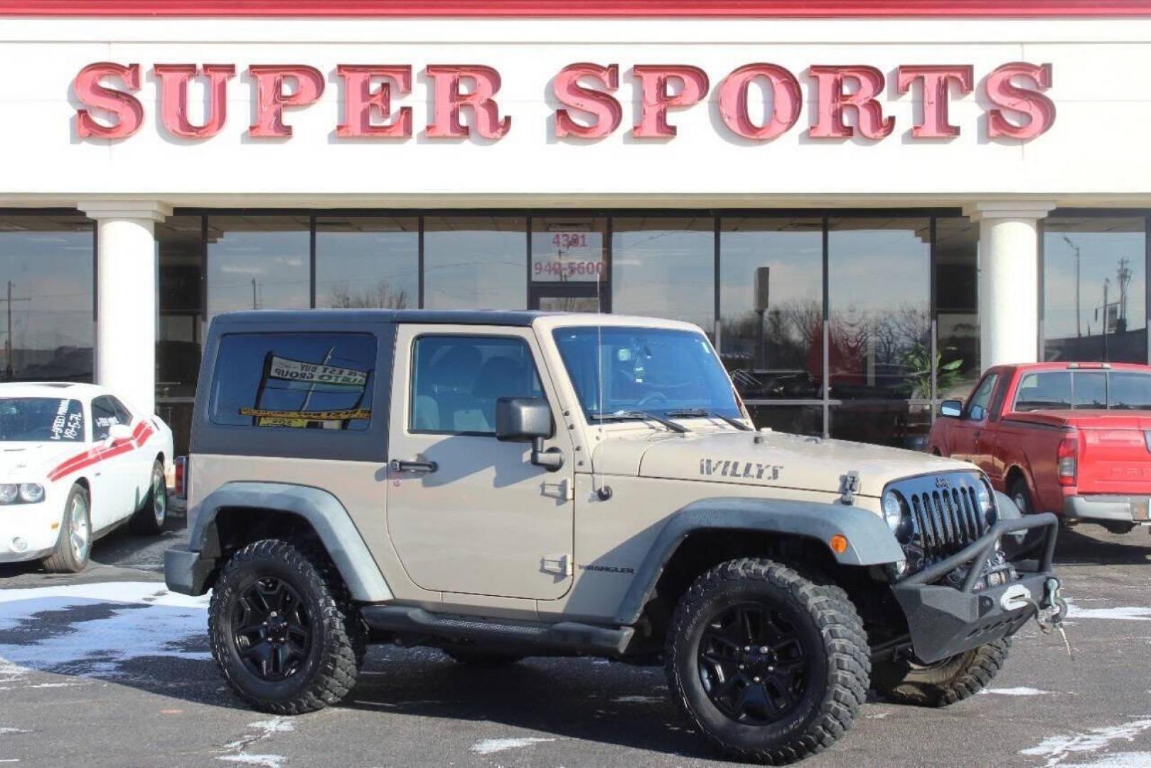 2016 Tan Jeep Wrangler Sport 4WD (1C4AJWAG7GL) with an 3.6L V6 DOHC 24V FFV engine, Automatic 5-Speed transmission, located at 4301 NW 39th , Oklahoma City, OK, 73112, (405) 949-5600, 35.512135, -97.598671 - NO DRIVERS LICENCE -NO FULL COVERAGE INSURANCE - NO CREDIT CHECK. COME ON OVER TO SUPERSPORTS, TAKE A LOOK AND TEST DRIVE. PLEASE GIVE US A CALL AT (405) 949-5600. NO LICENCIA DE CONDUCIR - NO SEGURO DE COBERTURA TOTAL - NO VERIFICACION DE CREDITO. VISITENOS EN SUPERSPORTS, MIRE NUESTRO - Photo#2