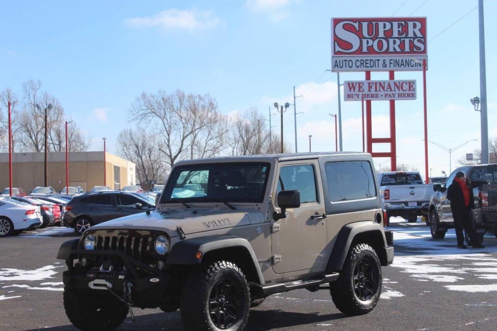 2016 Tan Jeep Wrangler Sport 4WD (1C4AJWAG7GL) with an 3.6L V6 DOHC 24V FFV engine, Automatic 5-Speed transmission, located at 4301 NW 39th , Oklahoma City, OK, 73112, (405) 949-5600, 35.512135, -97.598671 - NO DRIVERS LICENCE -NO FULL COVERAGE INSURANCE - NO CREDIT CHECK. COME ON OVER TO SUPERSPORTS, TAKE A LOOK AND TEST DRIVE. PLEASE GIVE US A CALL AT (405) 949-5600. NO LICENCIA DE CONDUCIR - NO SEGURO DE COBERTURA TOTAL - NO VERIFICACION DE CREDITO. VISITENOS EN SUPERSPORTS, MIRE NUESTRO - Photo#7