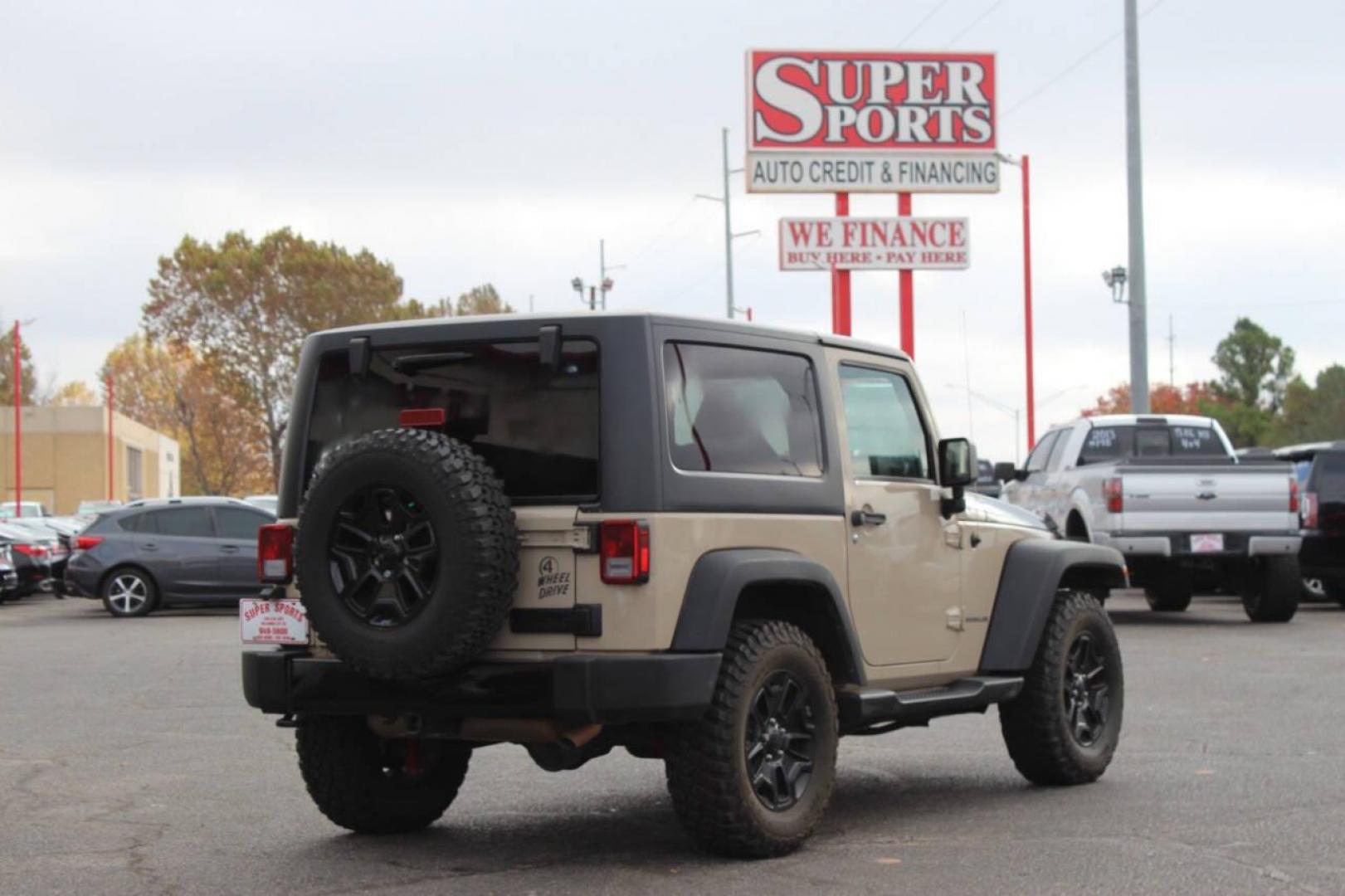 2016 Tan Jeep Wrangler Sport 4WD (1C4AJWAG7GL) with an 3.6L V6 DOHC 24V FFV engine, Automatic 5-Speed transmission, located at 4301 NW 39th , Oklahoma City, OK, 73112, (405) 949-5600, 35.512135, -97.598671 - NO DRIVERS LICENCE -NO FULL COVERAGE INSURANCE - NO CREDIT CHECK. COME ON OVER TO SUPERSPORTS, TAKE A LOOK AND TEST DRIVE. PLEASE GIVE US A CALL AT (405) 949-5600. NO LICENCIA DE CONDUCIR - NO SEGURO DE COBERTURA TOTAL - NO VERIFICACION DE CREDITO. VISITENOS EN SUPERSPORTS, MIRE NUESTRO - Photo#3