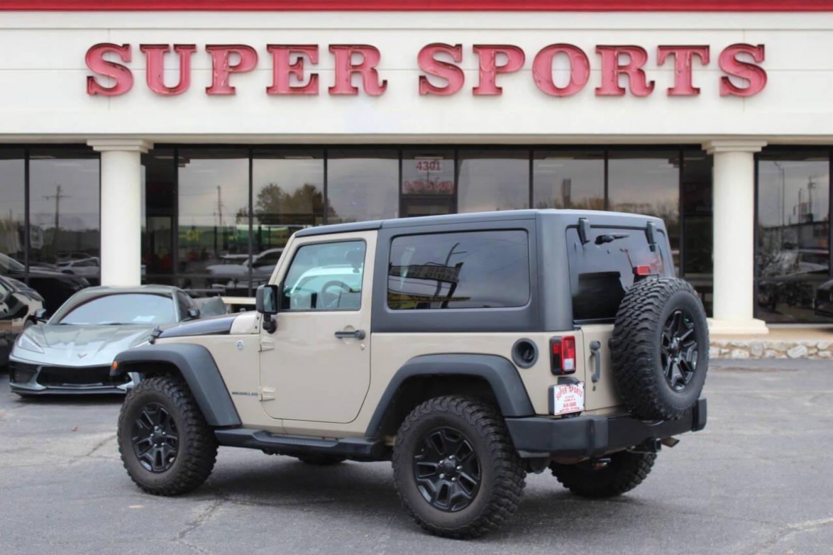 2016 Tan Jeep Wrangler Sport 4WD (1C4AJWAG7GL) with an 3.6L V6 DOHC 24V FFV engine, Automatic 5-Speed transmission, located at 4301 NW 39th , Oklahoma City, OK, 73112, (405) 949-5600, 35.512135, -97.598671 - NO DRIVERS LICENCE -NO FULL COVERAGE INSURANCE - NO CREDIT CHECK. COME ON OVER TO SUPERSPORTS, TAKE A LOOK AND TEST DRIVE. PLEASE GIVE US A CALL AT (405) 949-5600. NO LICENCIA DE CONDUCIR - NO SEGURO DE COBERTURA TOTAL - NO VERIFICACION DE CREDITO. VISITENOS EN SUPERSPORTS, MIRE NUESTRO - Photo#4