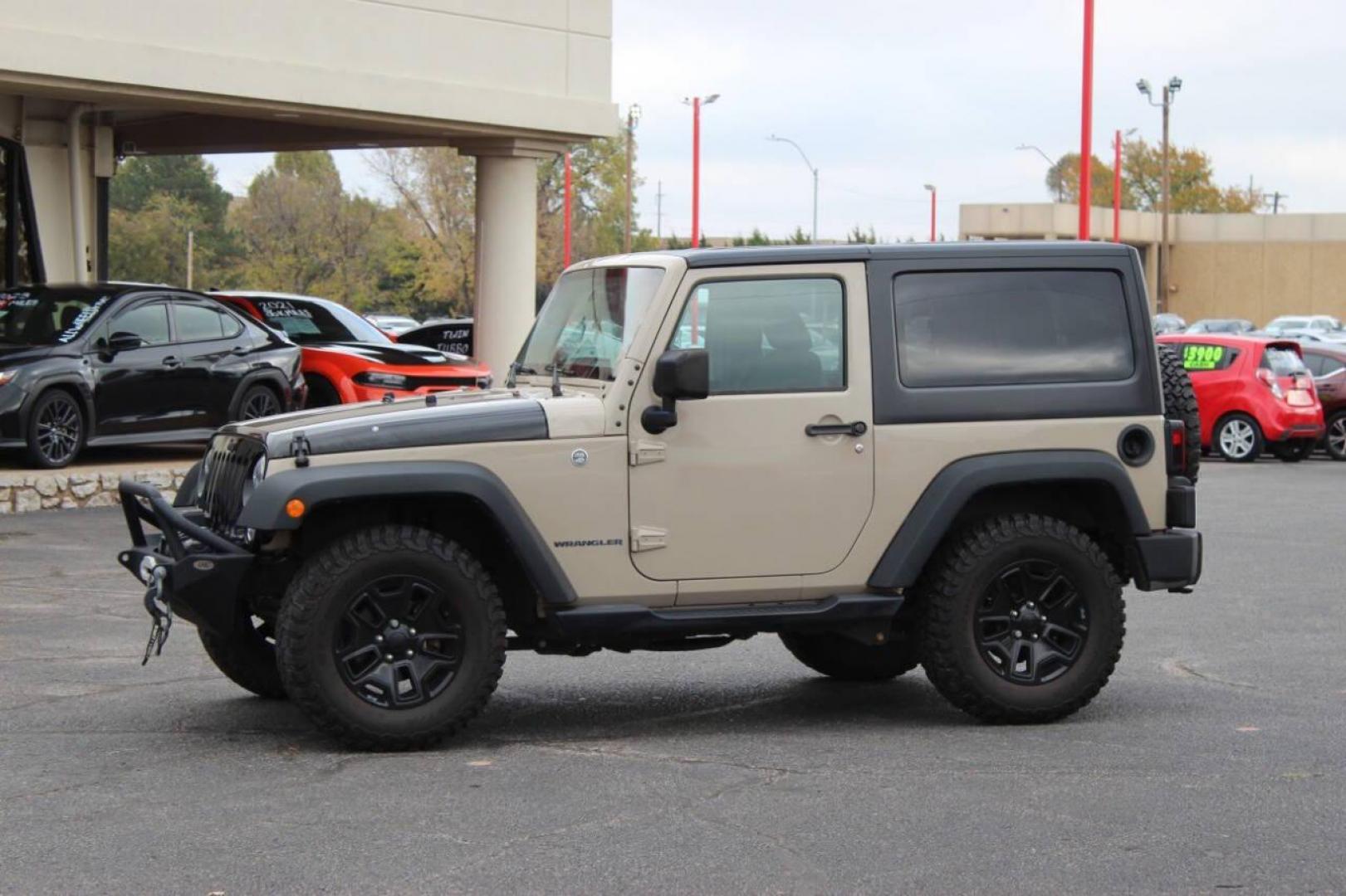2016 Tan Jeep Wrangler Sport 4WD (1C4AJWAG7GL) with an 3.6L V6 DOHC 24V FFV engine, Automatic 5-Speed transmission, located at 4301 NW 39th , Oklahoma City, OK, 73112, (405) 949-5600, 35.512135, -97.598671 - NO DRIVERS LICENCE -NO FULL COVERAGE INSURANCE - NO CREDIT CHECK. COME ON OVER TO SUPERSPORTS, TAKE A LOOK AND TEST DRIVE. PLEASE GIVE US A CALL AT (405) 949-5600. NO LICENCIA DE CONDUCIR - NO SEGURO DE COBERTURA TOTAL - NO VERIFICACION DE CREDITO. VISITENOS EN SUPERSPORTS, MIRE NUESTRO - Photo#5