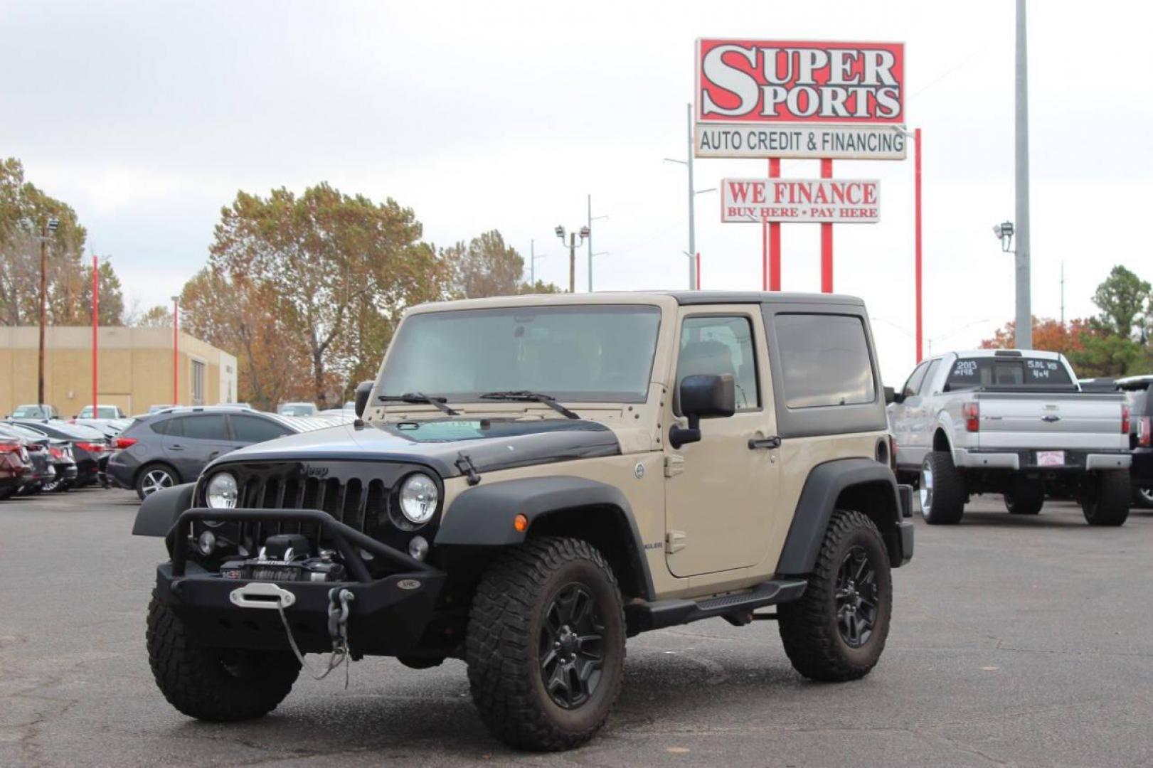 2016 Tan Jeep Wrangler Sport 4WD (1C4AJWAG7GL) with an 3.6L V6 DOHC 24V FFV engine, Automatic 5-Speed transmission, located at 4301 NW 39th , Oklahoma City, OK, 73112, (405) 949-5600, 35.512135, -97.598671 - NO DRIVERS LICENCE -NO FULL COVERAGE INSURANCE - NO CREDIT CHECK. COME ON OVER TO SUPERSPORTS, TAKE A LOOK AND TEST DRIVE. PLEASE GIVE US A CALL AT (405) 949-5600. NO LICENCIA DE CONDUCIR - NO SEGURO DE COBERTURA TOTAL - NO VERIFICACION DE CREDITO. VISITENOS EN SUPERSPORTS, MIRE NUESTRO - Photo#6