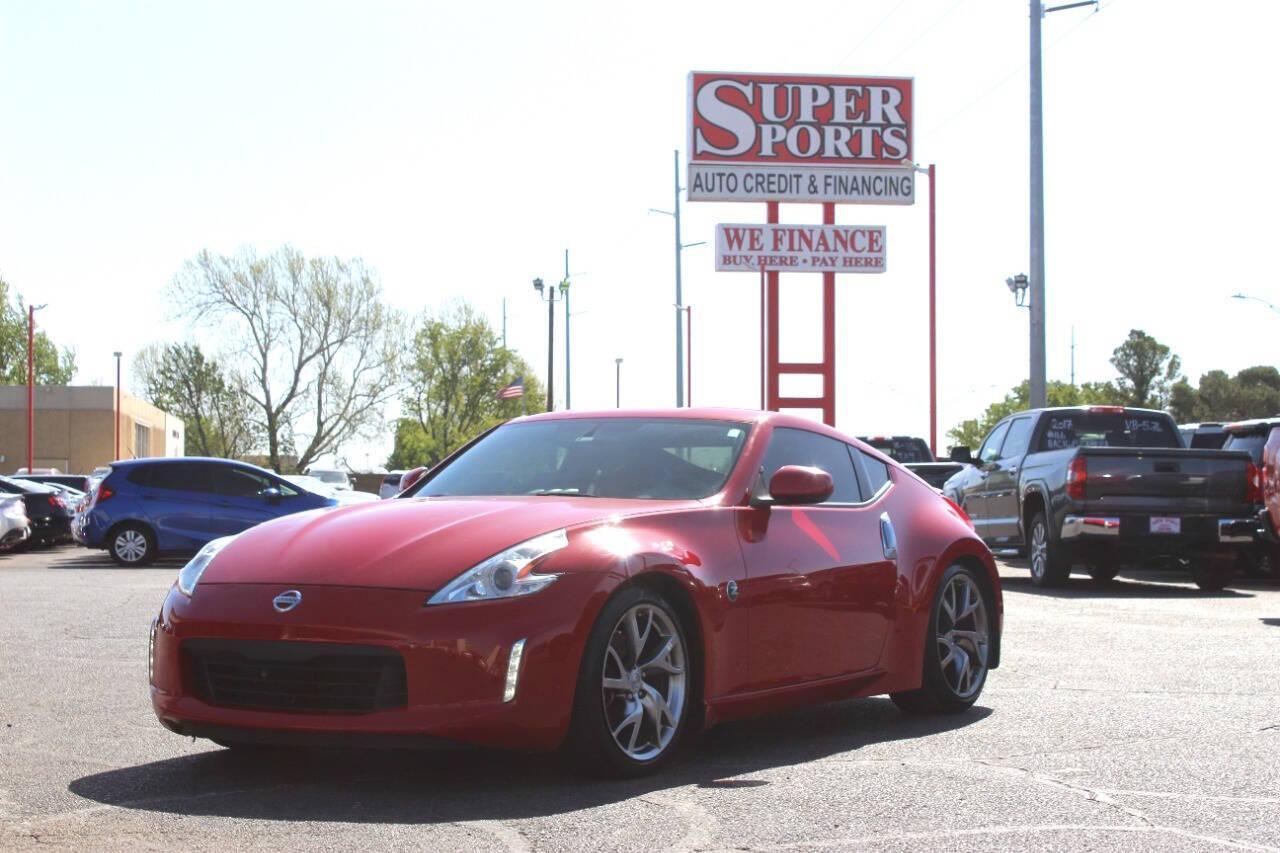 2015 Red Nissan Z 370Z Coupe Touring 6MT (JN1AZ4EH4FM) with an 3.7L V6 DOHC 24V engine, 6-Speed Manual transmission, located at 4301 NW 39th , Oklahoma City, OK, 73112, (405) 949-5600, 35.512135, -97.598671 - NO DRIVERS LICENCE -NO FULL COVERAGE INSURANCE - NO CREDIT CHECK. COME ON OVER TO SUPERSPORTS, TAKE A LOOK AND TEST DRIVE. PLEASE GIVE US A CALL AT (405) 949-5600. NO LICENCIA DE CONDUCIR - NO SEGURO DE COBERTURA TOTAL - NO VERIFICACION DE CREDITO. VISITENOS EN SUPERSPORTS, MIRE NUESTRO - Photo#6