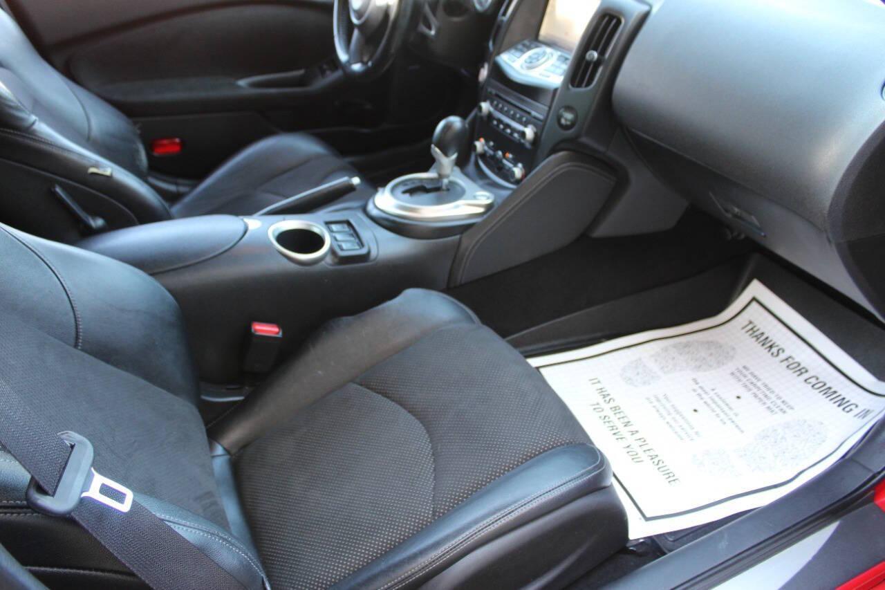 2015 Red Nissan Z 370Z Coupe Touring 6MT (JN1AZ4EH4FM) with an 3.7L V6 DOHC 24V engine, 6-Speed Manual transmission, located at 4301 NW 39th , Oklahoma City, OK, 73112, (405) 949-5600, 35.512135, -97.598671 - NO DRIVERS LICENCE -NO FULL COVERAGE INSURANCE - NO CREDIT CHECK. COME ON OVER TO SUPERSPORTS, TAKE A LOOK AND TEST DRIVE. PLEASE GIVE US A CALL AT (405) 949-5600. NO LICENCIA DE CONDUCIR - NO SEGURO DE COBERTURA TOTAL - NO VERIFICACION DE CREDITO. VISITENOS EN SUPERSPORTS, MIRE NUESTRO - Photo#8