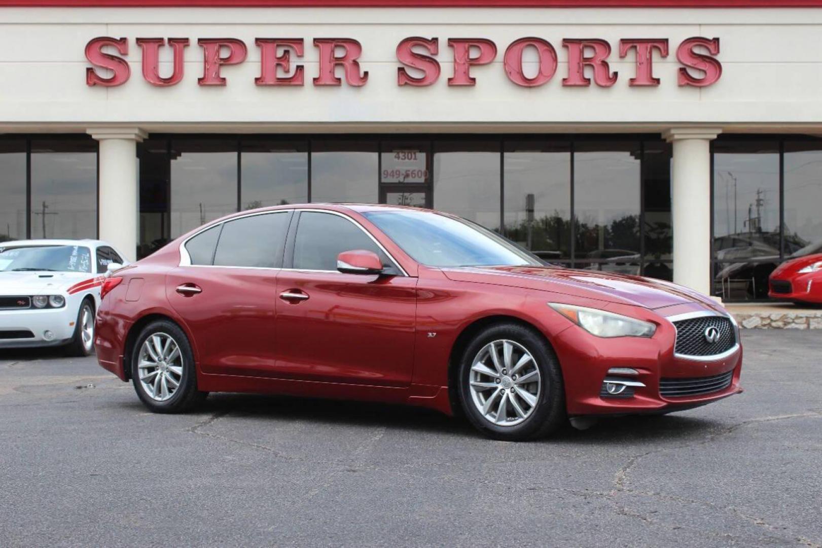2014 Burgundy Infiniti Q50 Premium (JN1BV7AP2EM) with an 3.7L V6 DOHC 24V HYBRID engine, 7-Speed Automatic transmission, located at 4301 NW 39th , Oklahoma City, OK, 73112, (405) 949-5600, 35.512135, -97.598671 - NO DRIVERS LICENCE NO-FULL COVERAGE INSURANCE-NO CREDIT CHECK. COME ON OVER TO SUPERSPORTS AND TAKE A LOOK AND TEST DRIVE. PLEASE GIVE US A CALL AT (405) 949-5600. NO LICENSIA DE MANEJAR- NO SEGURO DE COBERTURA TOTAL- NO VERIFICACCION DE CREDITO. POR FAVOR VENGAN A SUPERSPORTS, ECHE UN - Photo#2