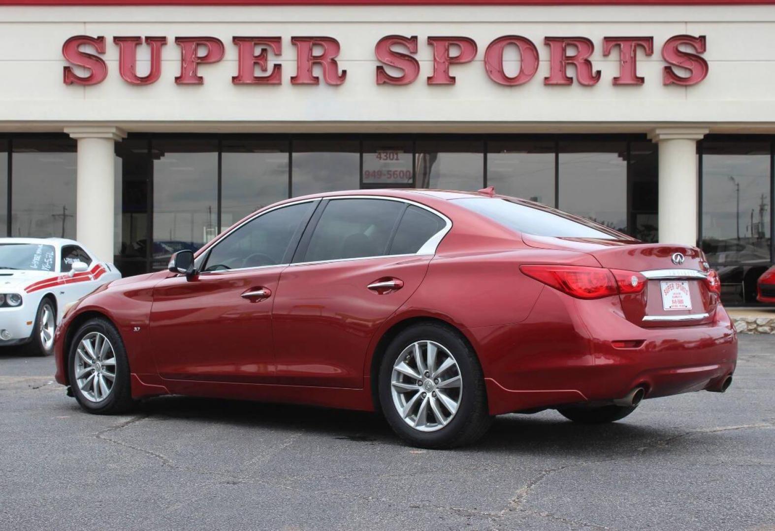 2014 Burgundy Infiniti Q50 Premium (JN1BV7AP2EM) with an 3.7L V6 DOHC 24V HYBRID engine, 7-Speed Automatic transmission, located at 4301 NW 39th , Oklahoma City, OK, 73112, (405) 949-5600, 35.512135, -97.598671 - NO DRIVERS LICENCE NO-FULL COVERAGE INSURANCE-NO CREDIT CHECK. COME ON OVER TO SUPERSPORTS AND TAKE A LOOK AND TEST DRIVE. PLEASE GIVE US A CALL AT (405) 949-5600. NO LICENSIA DE MANEJAR- NO SEGURO DE COBERTURA TOTAL- NO VERIFICACCION DE CREDITO. POR FAVOR VENGAN A SUPERSPORTS, ECHE UN - Photo#5