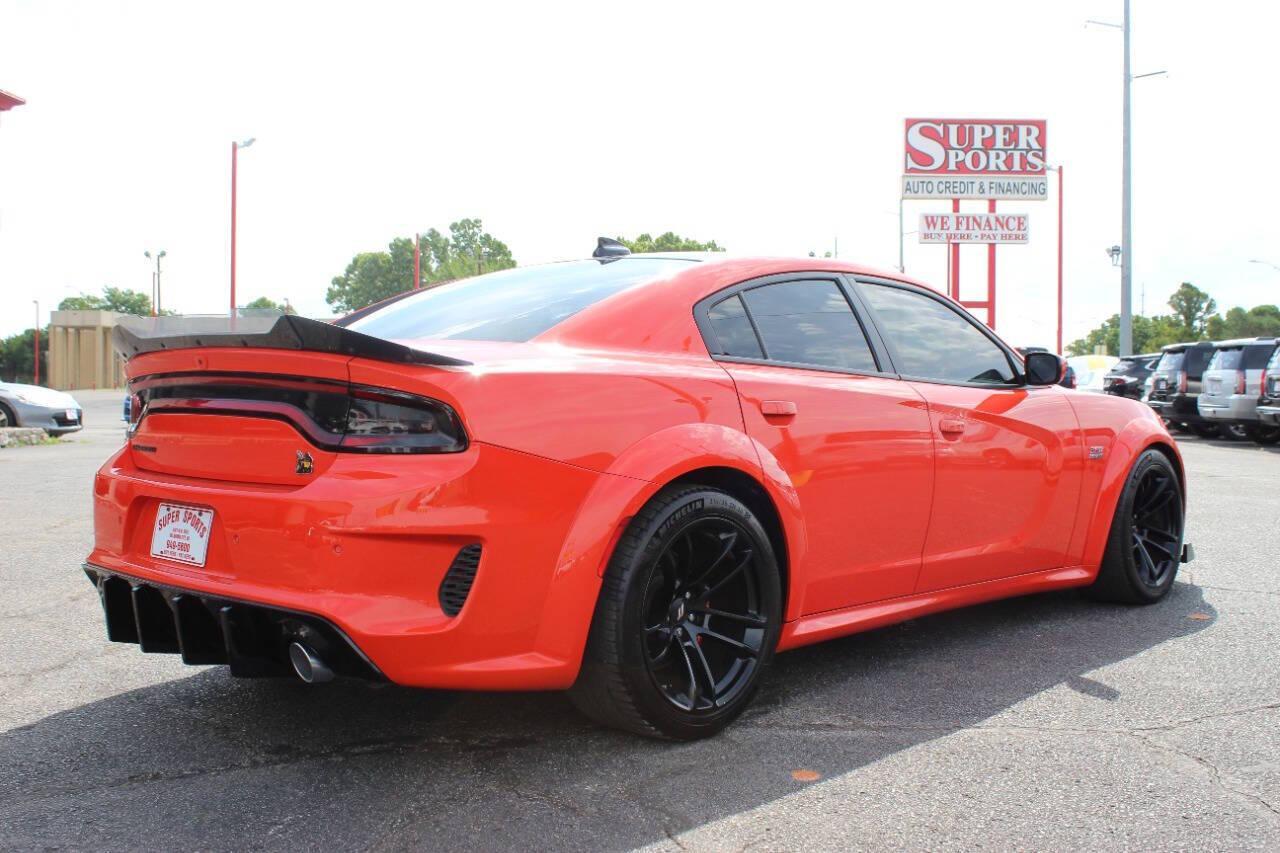 2021 Orange Dodge Charger Scat Pack (2C3CDXGJ8MH) with an 6.4L V8 OHV 16V engine, 8A transmission, located at 4301 NW 39th , Oklahoma City, OK, 73112, (405) 949-5600, 35.512135, -97.598671 - NO DRIVERS LICENCE -NO FULL COVERAGE INSURANCE - NO CREDIT CHECK. COME ON OVER TO SUPERSPORTS, TAKE A LOOK AND TEST DRIVE. PLEASE GIVE US A CALL AT (405) 949-5600. NO LICENCIA DE CONDUCIR - NO SEGURO DE COBERTURA TOTAL - NO VERIFICACION DE CREDITO. VISITENOS EN SUPERSPORTS, MIRE NUESTRO - Photo#3