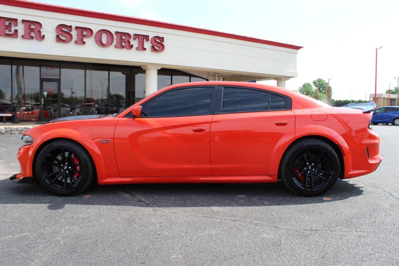 2021 Orange Dodge Charger Scat Pack (2C3CDXGJ8MH) with an 6.4L V8 OHV 16V engine, 8A transmission, located at 4301 NW 39th , Oklahoma City, OK, 73112, (405) 949-5600, 35.512135, -97.598671 - NO DRIVERS LICENCE -NO FULL COVERAGE INSURANCE - NO CREDIT CHECK. COME ON OVER TO SUPERSPORTS, TAKE A LOOK AND TEST DRIVE. PLEASE GIVE US A CALL AT (405) 949-5600. NO LICENCIA DE CONDUCIR - NO SEGURO DE COBERTURA TOTAL - NO VERIFICACION DE CREDITO. VISITENOS EN SUPERSPORTS, MIRE NUESTRO - Photo#5