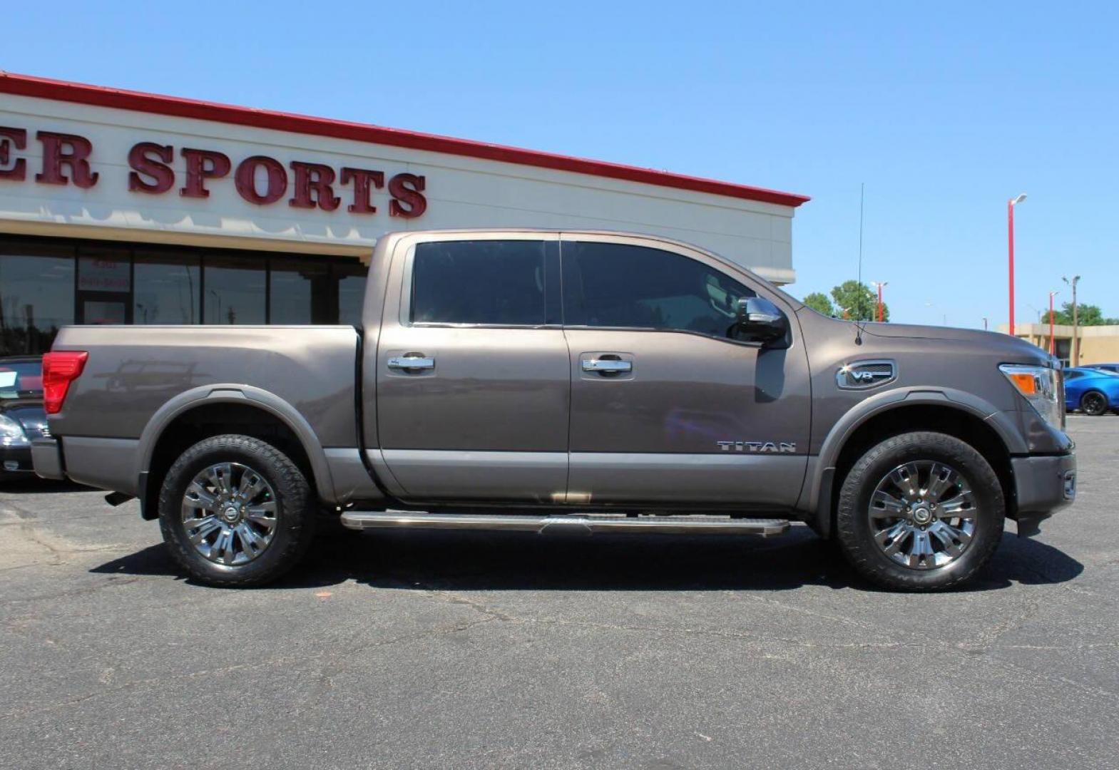 2017 Tan Nissan Titan Platinum Reserve Crew Cab 4WD (1N6AA1E57HN) with an 5.6L V8 5.6L V8 engine, Automatic 7-Speed transmission, located at 4301 NW 39th , Oklahoma City, OK, 73112, (405) 949-5600, 35.512135, -97.598671 - Photo#2