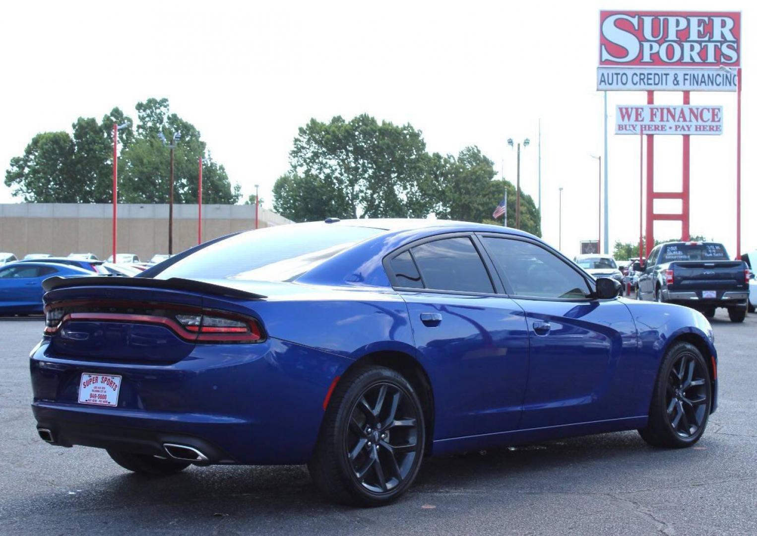 2022 Blue Dodge Charger SXT (2C3CDXBG8NH) with an 3.6L V6 DOHC 24V engine, 8A transmission, located at 4301 NW 39th , Oklahoma City, OK, 73112, (405) 949-5600, 35.512135, -97.598671 - NO DRIVERS LICENCE -NO FULL COVERAGE INSURANCE - NO CREDIT CHECK. COME ON OVER TO SUPERSPORTS, TAKE A LOOK AND TEST DRIVE. PLEASE GIVE US A CALL AT (405) 949-5600. NO LICENCIA DE CONDUCIR - NO SEGURO DE COBERTURA TOTAL - NO VERIFICACION DE CREDITO. VISITENOS EN SUPERSPORTS, MIRE NUESTRO - Photo#4