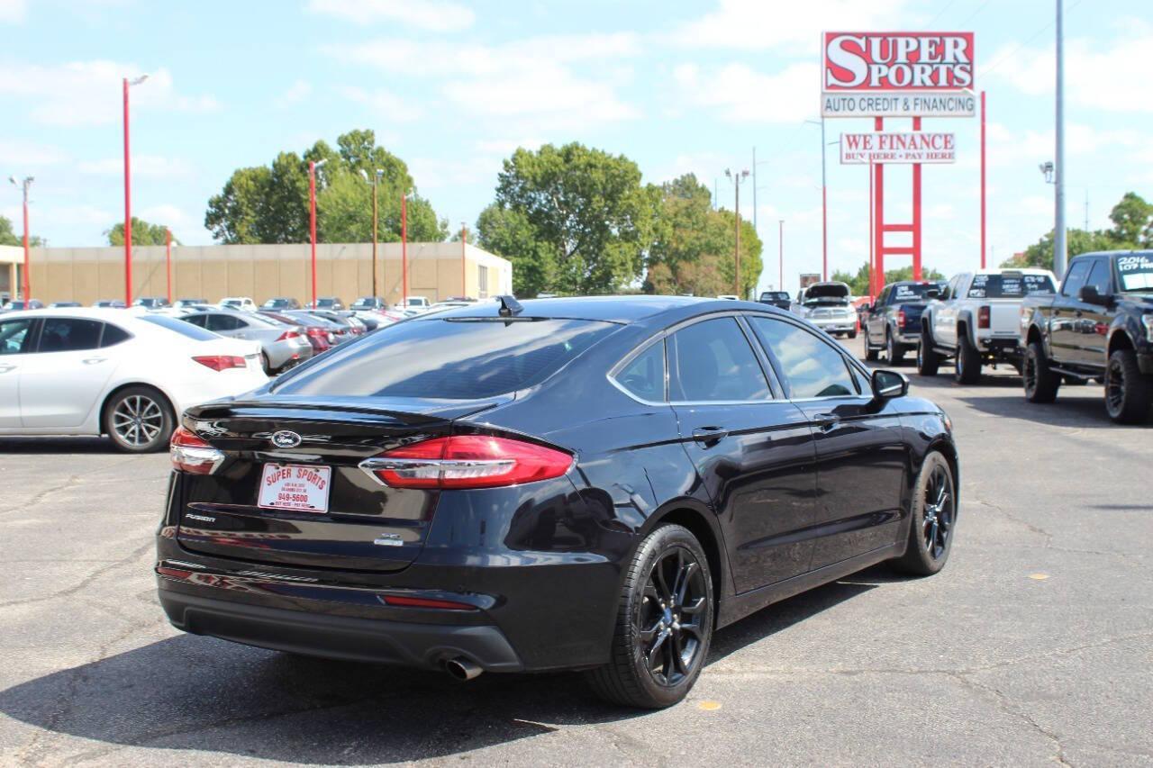 2019 Black Ford Fusion SE (3FA6P0HD6KR) with an 1.5L L4 DOHC 16V engine, 6A transmission, located at 4301 NW 39th , Oklahoma City, OK, 73112, (405) 949-5600, 35.512135, -97.598671 - NO DRIVERS LICENCE -NO FULL COVERAGE INSURANCE - NO CREDIT CHECK. COME ON OVER TO SUPERSPORTS, TAKE A LOOK AND TEST DRIVE. PLEASE GIVE US A CALL AT (405) 949-5600. NO LICENCIA DE CONDUCIR - NO SEGURO DE COBERTURA TOTAL - NO VERIFICACION DE CREDITO. VISITENOS EN SUPERSPORTS, MIRE NUESTRO - Photo#3