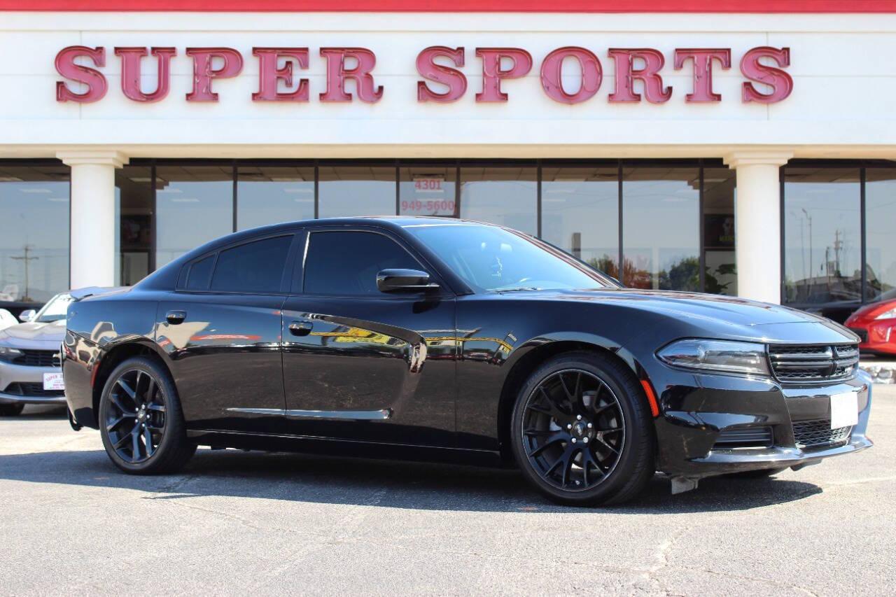 2022 Black Dodge Charger SXT (2C3CDXBGXNH) with an 3.6L V6 DOHC 24V engine, 8A transmission, located at 4301 NW 39th , Oklahoma City, OK, 73112, (405) 949-5600, 35.512135, -97.598671 - NO DRIVERS LICENCE NO-FULL COVERAGE INSURANCE-NO CREDIT CHECK. COME ON OVER TO SUPERSPORTS AND TAKE A LOOK AND TEST DRIVE. PLEASE GIVE US A CALL AT (405) 949-5600. NO LICENSIA DE MANEJAR- NO SEGURO DE COBERTURA TOTAL- NO VERIFICACCION DE CREDITO. POR FAVOR VENGAN A SUPERSPORTS, ECHE UN - Photo#0