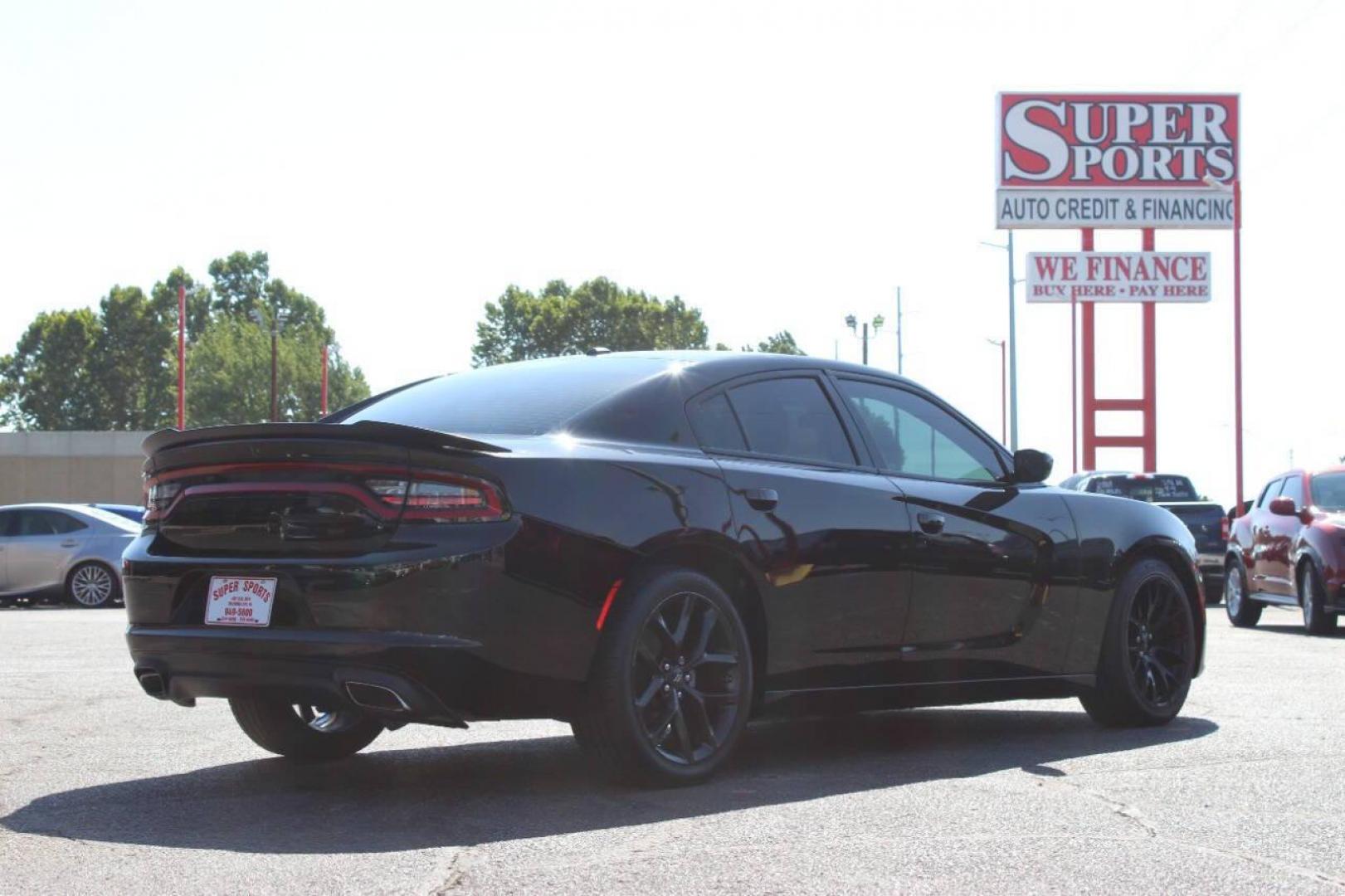 2022 Black Dodge Charger SXT (2C3CDXBGXNH) with an 3.6L V6 DOHC 24V engine, 8A transmission, located at 4301 NW 39th , Oklahoma City, OK, 73112, (405) 949-5600, 35.512135, -97.598671 - NO DRIVERS LICENCE NO-FULL COVERAGE INSURANCE-NO CREDIT CHECK. COME ON OVER TO SUPERSPORTS AND TAKE A LOOK AND TEST DRIVE. PLEASE GIVE US A CALL AT (405) 949-5600. NO LICENSIA DE MANEJAR- NO SEGURO DE COBERTURA TOTAL- NO VERIFICACCION DE CREDITO. POR FAVOR VENGAN A SUPERSPORTS, ECHE UN - Photo#4