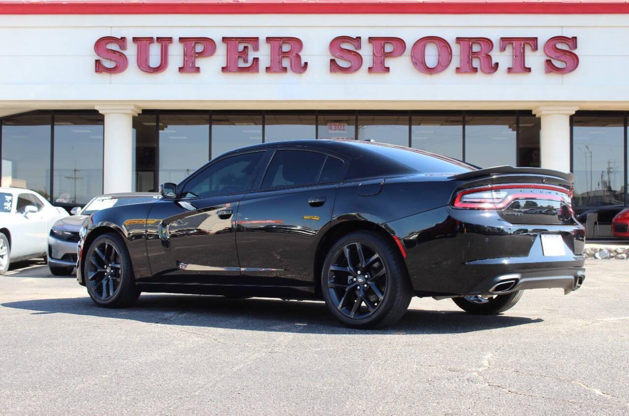 2022 Black Dodge Charger SXT (2C3CDXBGXNH) with an 3.6L V6 DOHC 24V engine, 8A transmission, located at 4301 NW 39th , Oklahoma City, OK, 73112, (405) 949-5600, 35.512135, -97.598671 - NO DRIVERS LICENCE NO-FULL COVERAGE INSURANCE-NO CREDIT CHECK. COME ON OVER TO SUPERSPORTS AND TAKE A LOOK AND TEST DRIVE. PLEASE GIVE US A CALL AT (405) 949-5600. NO LICENSIA DE MANEJAR- NO SEGURO DE COBERTURA TOTAL- NO VERIFICACCION DE CREDITO. POR FAVOR VENGAN A SUPERSPORTS, ECHE UN - Photo#4