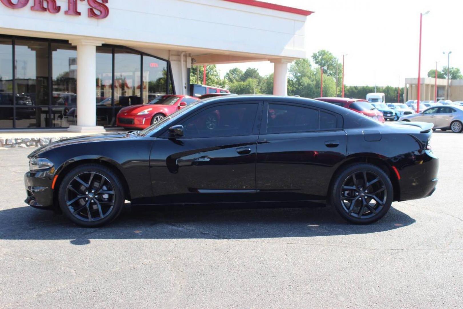 2022 Black Dodge Charger SXT (2C3CDXBGXNH) with an 3.6L V6 DOHC 24V engine, 8A transmission, located at 4301 NW 39th , Oklahoma City, OK, 73112, (405) 949-5600, 35.512135, -97.598671 - NO DRIVERS LICENCE NO-FULL COVERAGE INSURANCE-NO CREDIT CHECK. COME ON OVER TO SUPERSPORTS AND TAKE A LOOK AND TEST DRIVE. PLEASE GIVE US A CALL AT (405) 949-5600. NO LICENSIA DE MANEJAR- NO SEGURO DE COBERTURA TOTAL- NO VERIFICACCION DE CREDITO. POR FAVOR VENGAN A SUPERSPORTS, ECHE UN - Photo#6