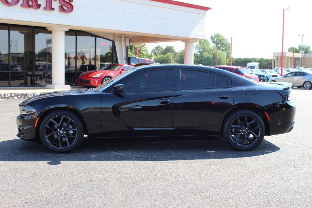 2022 Black Dodge Charger SXT (2C3CDXBGXNH) with an 3.6L V6 DOHC 24V engine, 8A transmission, located at 4301 NW 39th , Oklahoma City, OK, 73112, (405) 949-5600, 35.512135, -97.598671 - NO DRIVERS LICENCE NO-FULL COVERAGE INSURANCE-NO CREDIT CHECK. COME ON OVER TO SUPERSPORTS AND TAKE A LOOK AND TEST DRIVE. PLEASE GIVE US A CALL AT (405) 949-5600. NO LICENSIA DE MANEJAR- NO SEGURO DE COBERTURA TOTAL- NO VERIFICACCION DE CREDITO. POR FAVOR VENGAN A SUPERSPORTS, ECHE UN - Photo#5