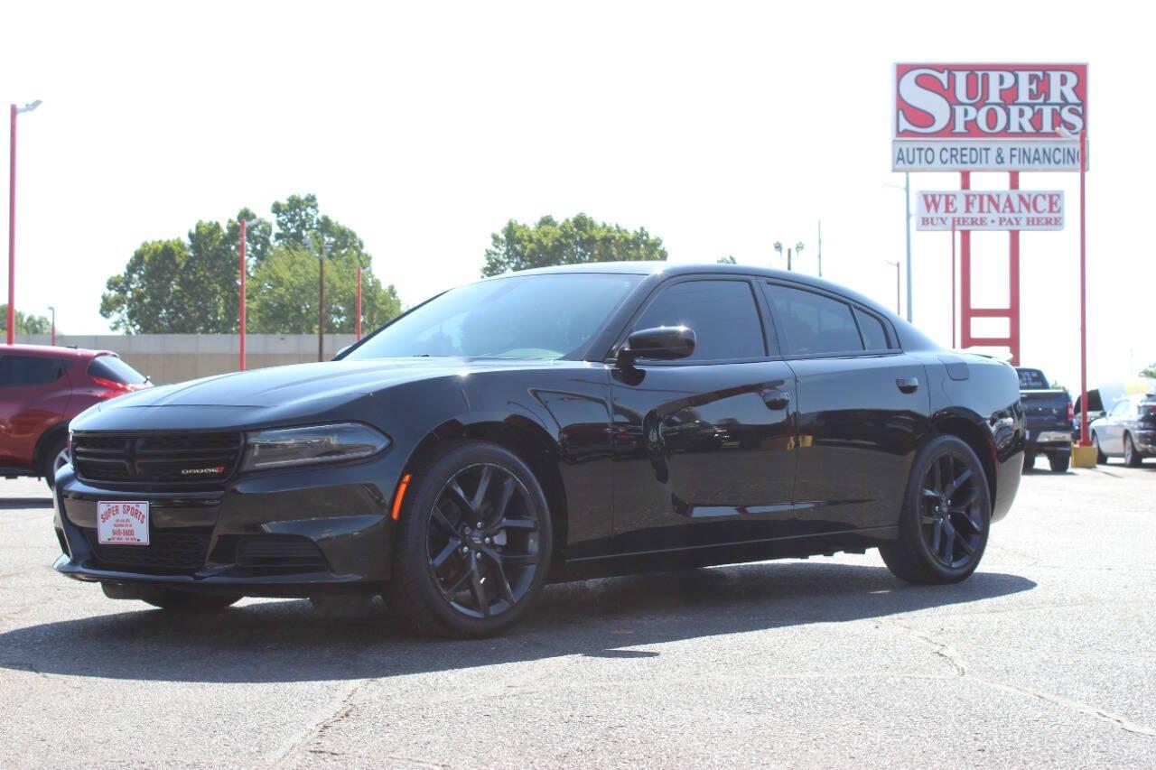 2022 Black Dodge Charger SXT (2C3CDXBGXNH) with an 3.6L V6 DOHC 24V engine, 8A transmission, located at 4301 NW 39th , Oklahoma City, OK, 73112, (405) 949-5600, 35.512135, -97.598671 - NO DRIVERS LICENCE NO-FULL COVERAGE INSURANCE-NO CREDIT CHECK. COME ON OVER TO SUPERSPORTS AND TAKE A LOOK AND TEST DRIVE. PLEASE GIVE US A CALL AT (405) 949-5600. NO LICENSIA DE MANEJAR- NO SEGURO DE COBERTURA TOTAL- NO VERIFICACCION DE CREDITO. POR FAVOR VENGAN A SUPERSPORTS, ECHE UN - Photo#6