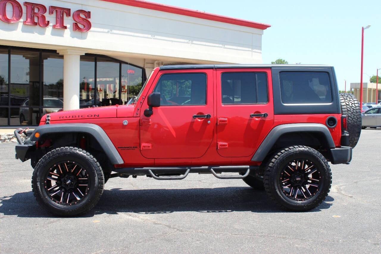 2017 Red Jeep Wrangler Unlimited Unlimited Rubicon 4WD (1C4BJWFGXHL) with an 3.6L V6 3.6L V6 engine, Automatic 5-Speed transmission, located at 4301 NW 39th , Oklahoma City, OK, 73112, (405) 949-5600, 35.512135, -97.598671 - Hablamos espanol. SPEND SMART --- BUY FROM SUPER SPORTS. ALL PRICES, DOWN PAYMENTS, PAYMENTS, AND FINANCE TERMS ARE NEGOTIABLE AT THE TIME OF APPROVAL. WE WILL WORK WITH YOU TO FIT YOUR BUDGET. WE WILL EVEN LOWER AND ADJUST THE NUMBERS TO HELP MAKE THE VEHICLE MORE AFFORDABLE FOR YOU.- Photo#5