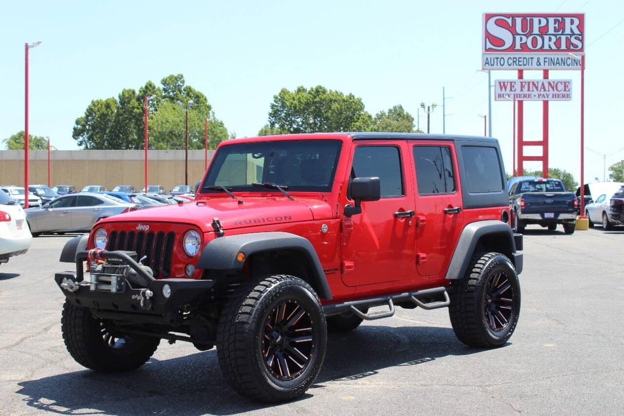 2017 Red Jeep Wrangler Unlimited Unlimited Rubicon 4WD (1C4BJWFGXHL) with an 3.6L V6 3.6L V6 engine, Automatic 5-Speed transmission, located at 4301 NW 39th , Oklahoma City, OK, 73112, (405) 949-5600, 35.512135, -97.598671 - Hablamos espanol. SPEND SMART --- BUY FROM SUPER SPORTS. ALL PRICES, DOWN PAYMENTS, PAYMENTS, AND FINANCE TERMS ARE NEGOTIABLE AT THE TIME OF APPROVAL. WE WILL WORK WITH YOU TO FIT YOUR BUDGET. WE WILL EVEN LOWER AND ADJUST THE NUMBERS TO HELP MAKE THE VEHICLE MORE AFFORDABLE FOR YOU.- Photo#6