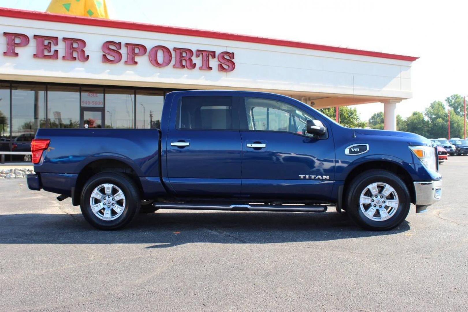 2017 Blue Nissan Titan Platinum Reserve Crew Cab 4WD (1N6AA1E58HN) with an 5.6L V8 DOHC 32V engine, 6A transmission, located at 4301 NW 39th , Oklahoma City, OK, 73112, (405) 949-5600, 35.512135, -97.598671 - NO DRIVERS LICENCE -NO FULL COVERAGE INSURANCE - NO CREDIT CHECK. COME ON OVER TO SUPERSPORTS, TAKE A LOOK AND TEST DRIVE. PLEASE GIVE US A CALL AT (405) 949-5600. NO LICENCIA DE CONDUCIR - NO SEGURO DE COBERTURA TOTAL - NO VERIFICACION DE CREDITO. VISITENOS EN SUPERSPORTS, MIRE NUESTRO - Photo#3