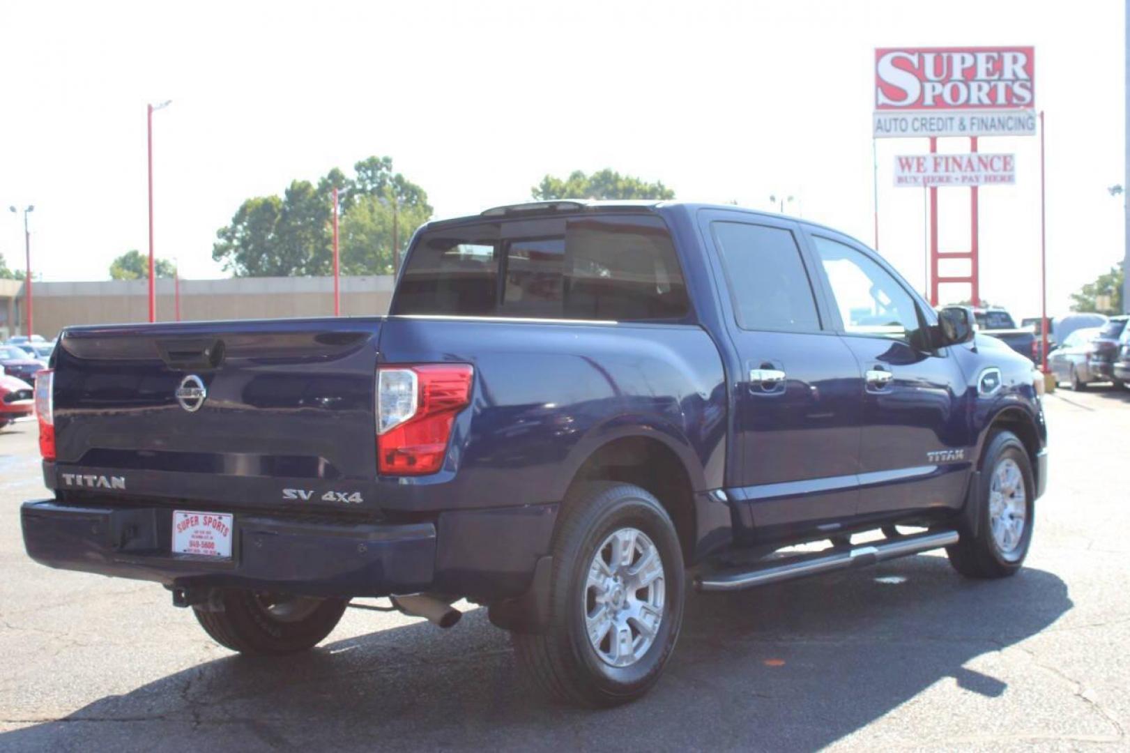 2017 Blue Nissan Titan Platinum Reserve Crew Cab 4WD (1N6AA1E58HN) with an 5.6L V8 DOHC 32V engine, 6A transmission, located at 4301 NW 39th , Oklahoma City, OK, 73112, (405) 949-5600, 35.512135, -97.598671 - NO DRIVERS LICENCE -NO FULL COVERAGE INSURANCE - NO CREDIT CHECK. COME ON OVER TO SUPERSPORTS, TAKE A LOOK AND TEST DRIVE. PLEASE GIVE US A CALL AT (405) 949-5600. NO LICENCIA DE CONDUCIR - NO SEGURO DE COBERTURA TOTAL - NO VERIFICACION DE CREDITO. VISITENOS EN SUPERSPORTS, MIRE NUESTRO - Photo#4