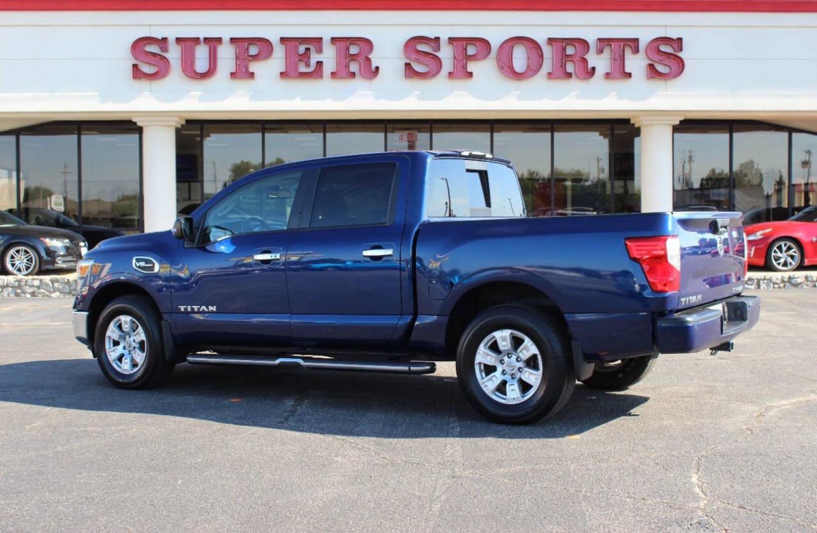 2017 Blue Nissan Titan Platinum Reserve Crew Cab 4WD (1N6AA1E58HN) with an 5.6L V8 DOHC 32V engine, 6A transmission, located at 4301 NW 39th , Oklahoma City, OK, 73112, (405) 949-5600, 35.512135, -97.598671 - NO DRIVERS LICENCE -NO FULL COVERAGE INSURANCE - NO CREDIT CHECK. COME ON OVER TO SUPERSPORTS, TAKE A LOOK AND TEST DRIVE. PLEASE GIVE US A CALL AT (405) 949-5600. NO LICENCIA DE CONDUCIR - NO SEGURO DE COBERTURA TOTAL - NO VERIFICACION DE CREDITO. VISITENOS EN SUPERSPORTS, MIRE NUESTRO - Photo#5